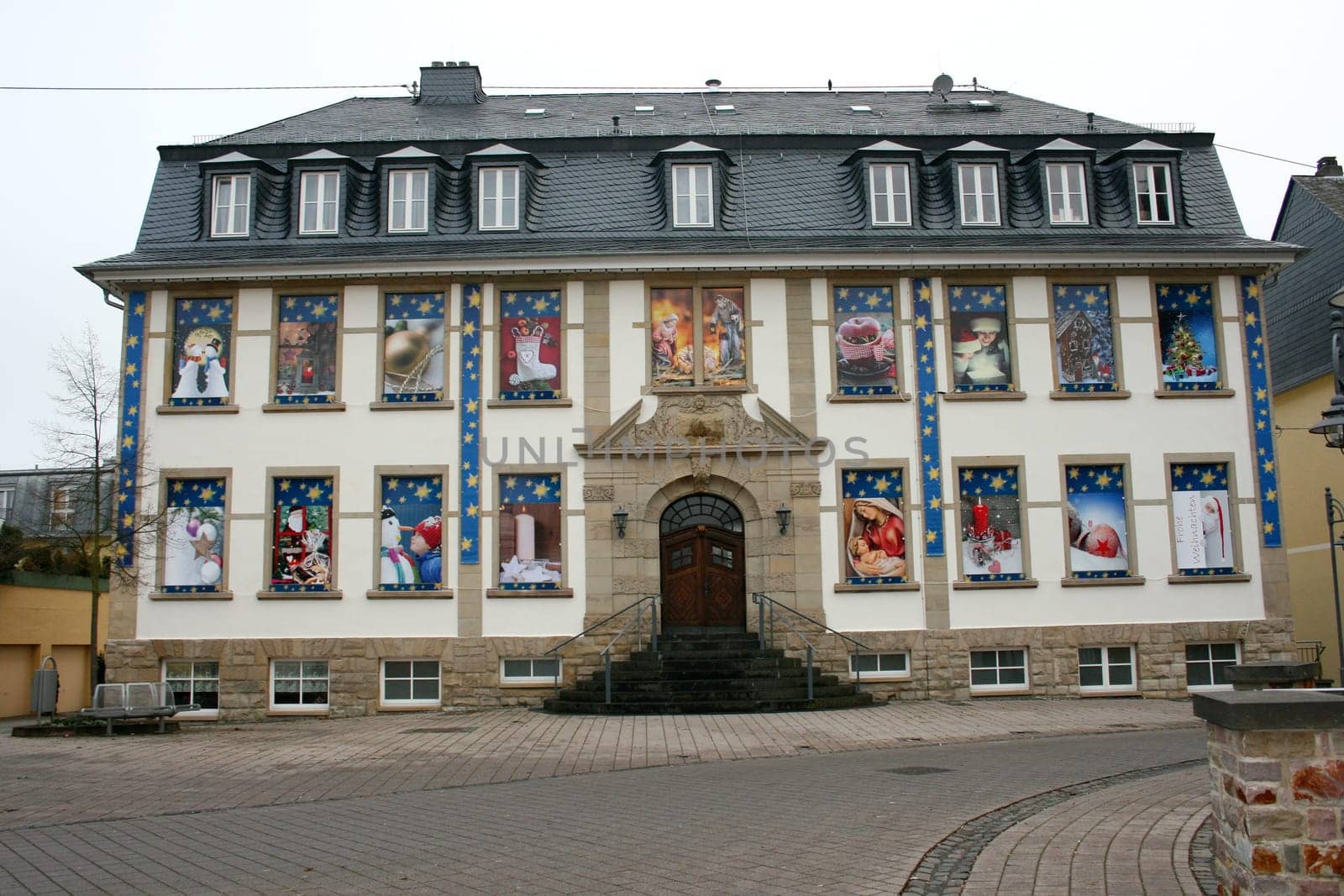 a Historical old building decorated for Christmas.