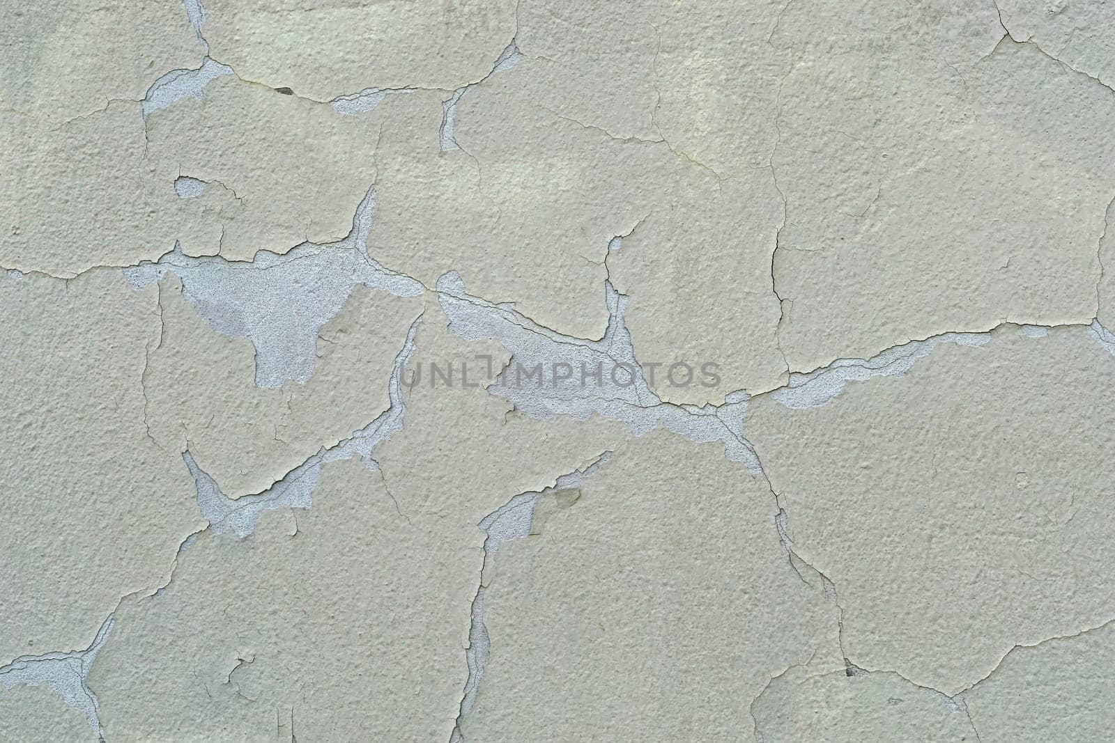 Cracked paint at house wall