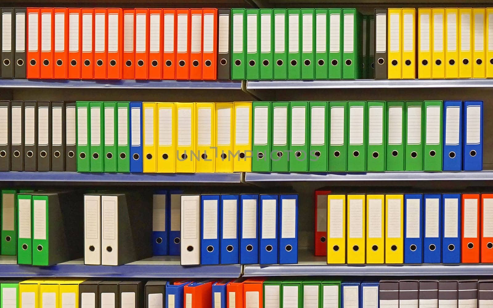 Shelf with colourful ring binders