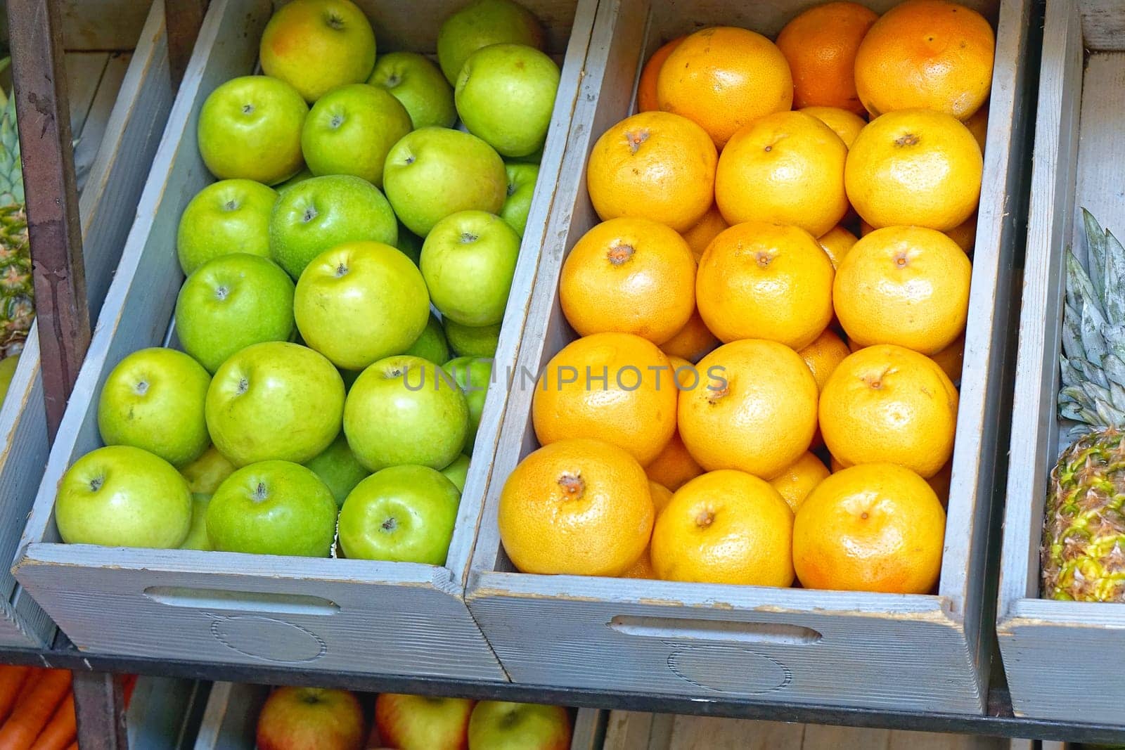 Crates with apples and oranges fruits