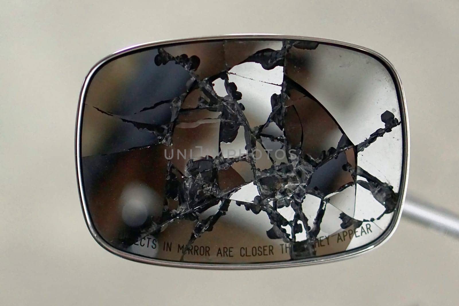 Broken rear view mirror at motorcycle