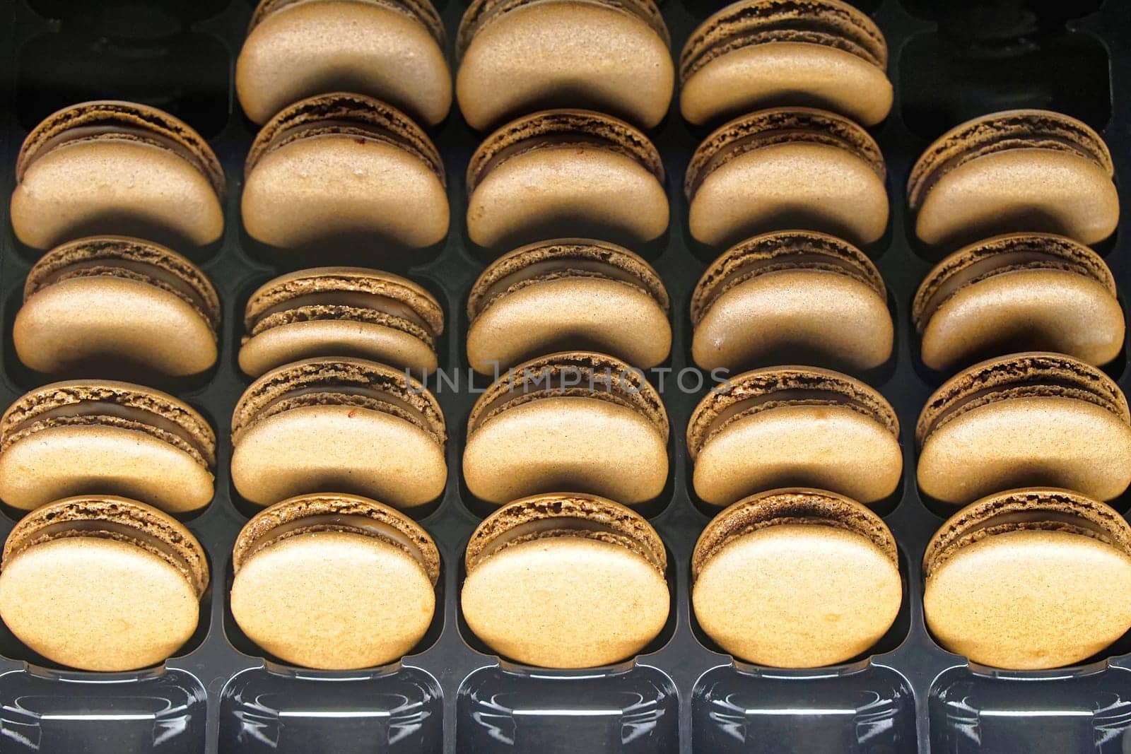 Stack of French chocolate macaroons cookies
