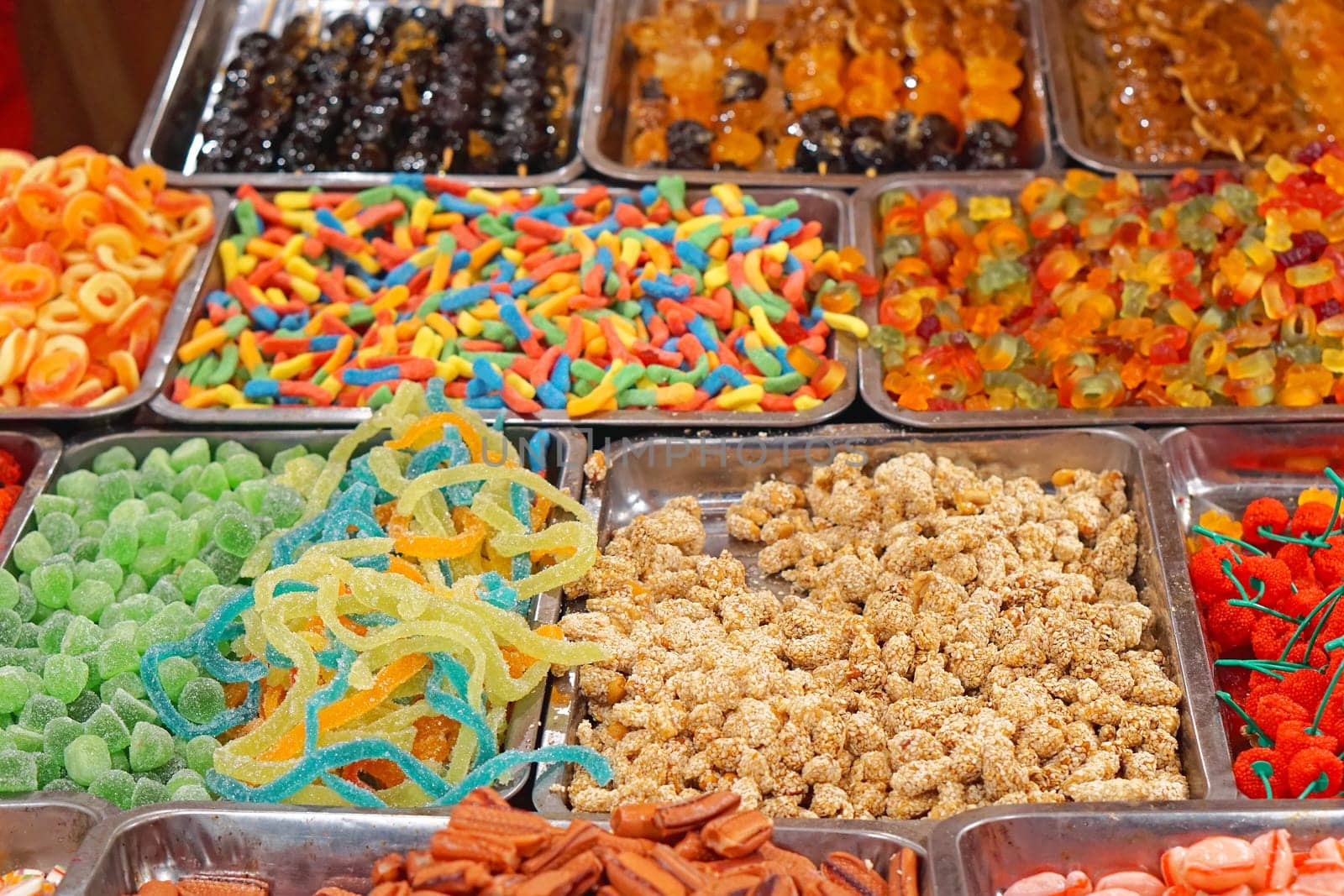 Big selection of gummy candies at market