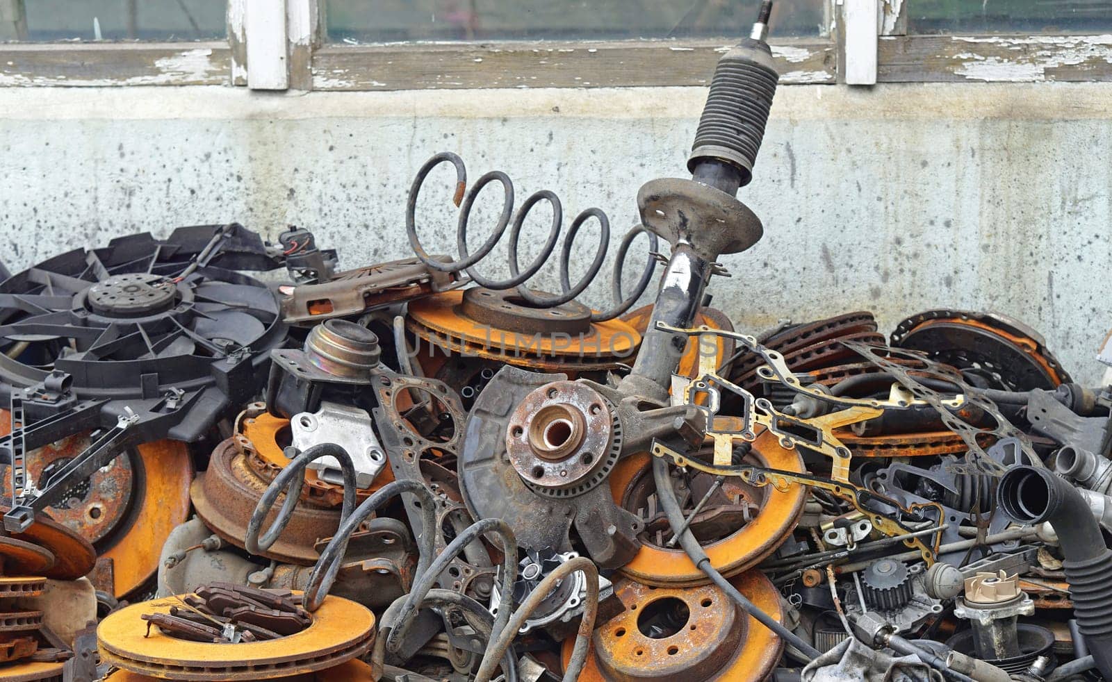Pile of old car parts scrap metal for recycling