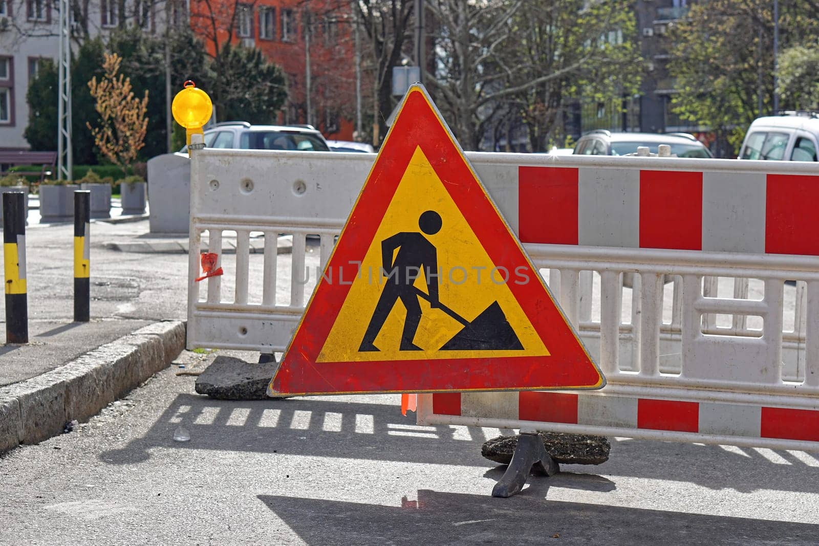 Road work traffic sign and construction arrier