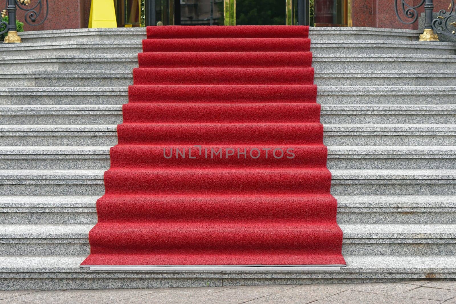 Red carpet at marble stairway luxury