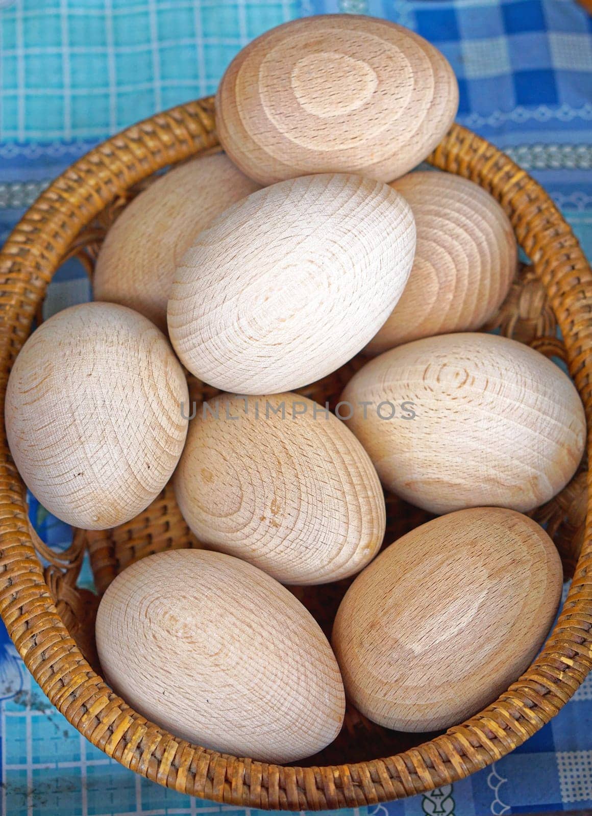 Big bunch of wooden eggs in basket