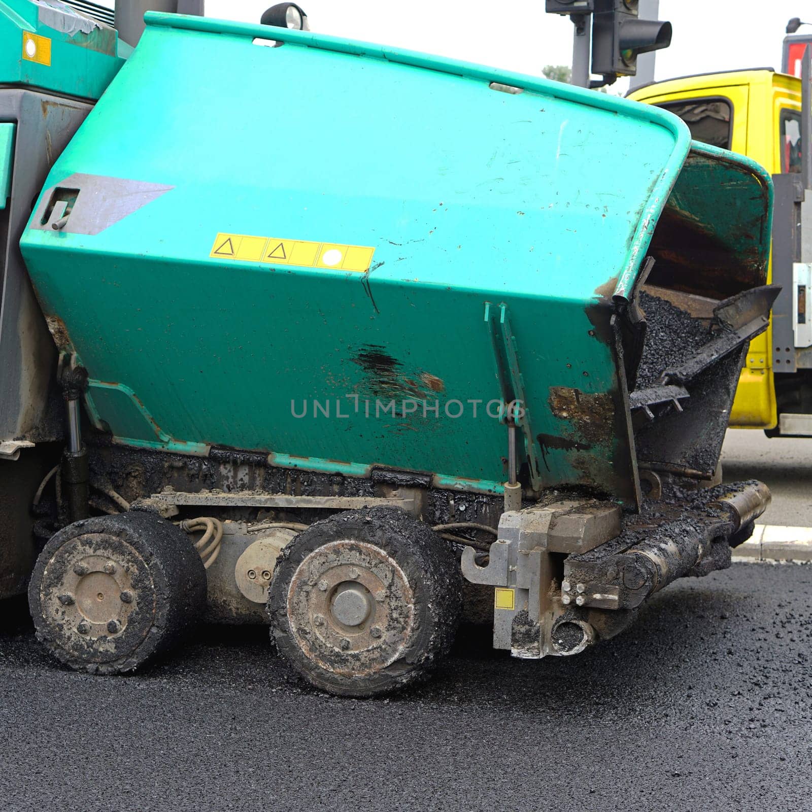 Asphalting works surfacing road machine