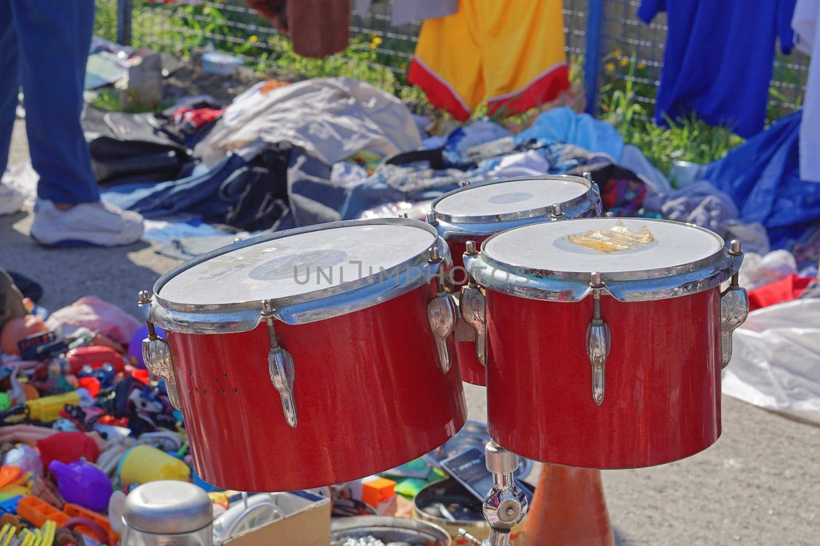 Beaten red drums for sale at flea market