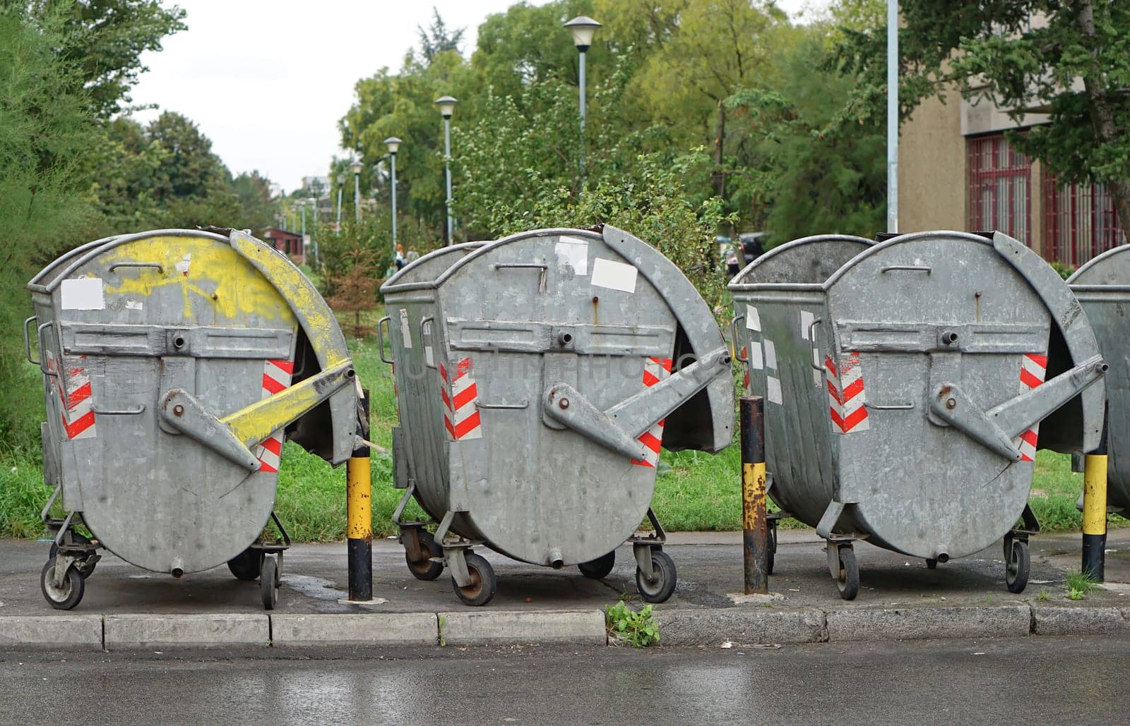 Big metal waste containers at street