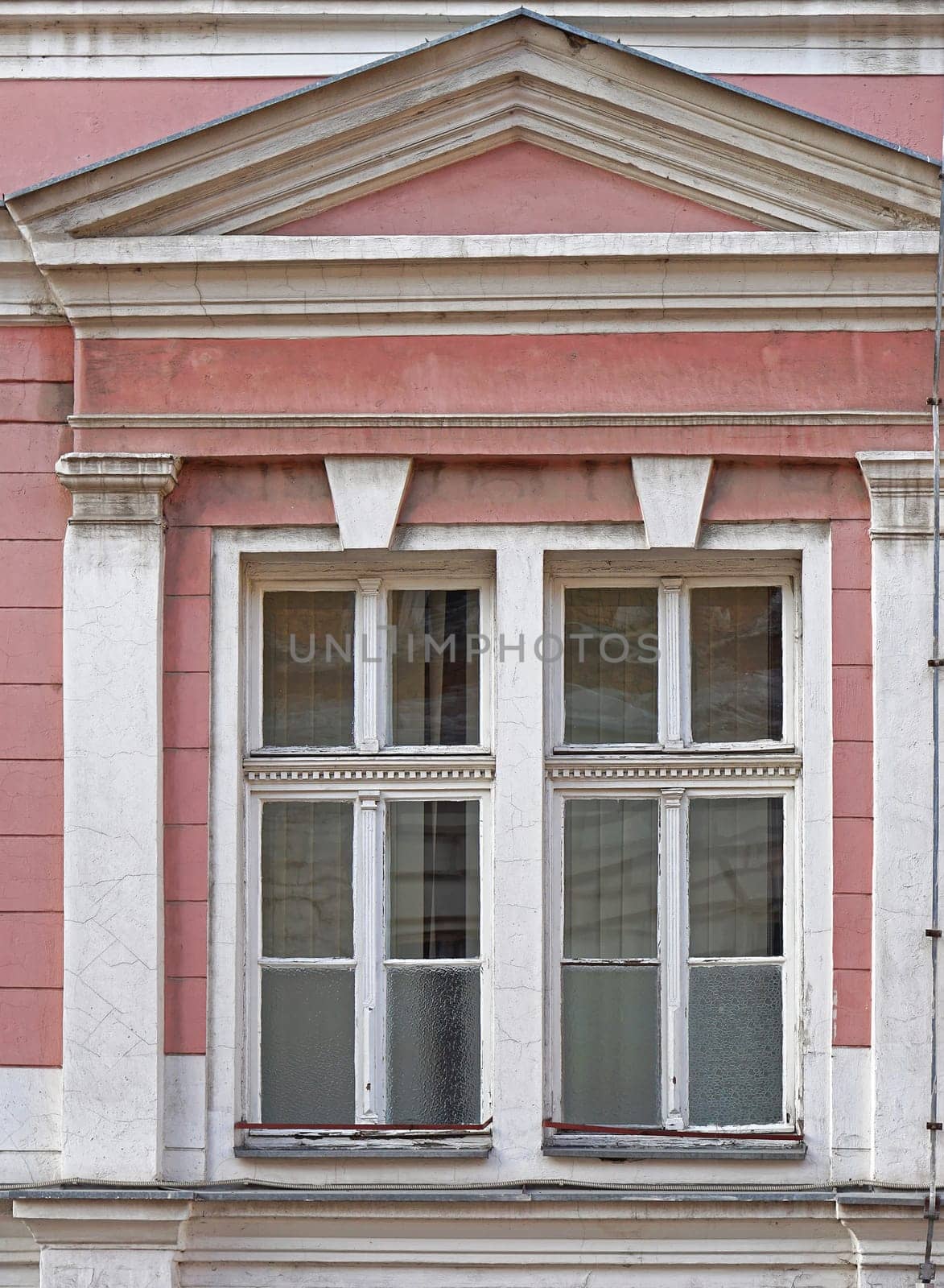 Two windows at classic style building