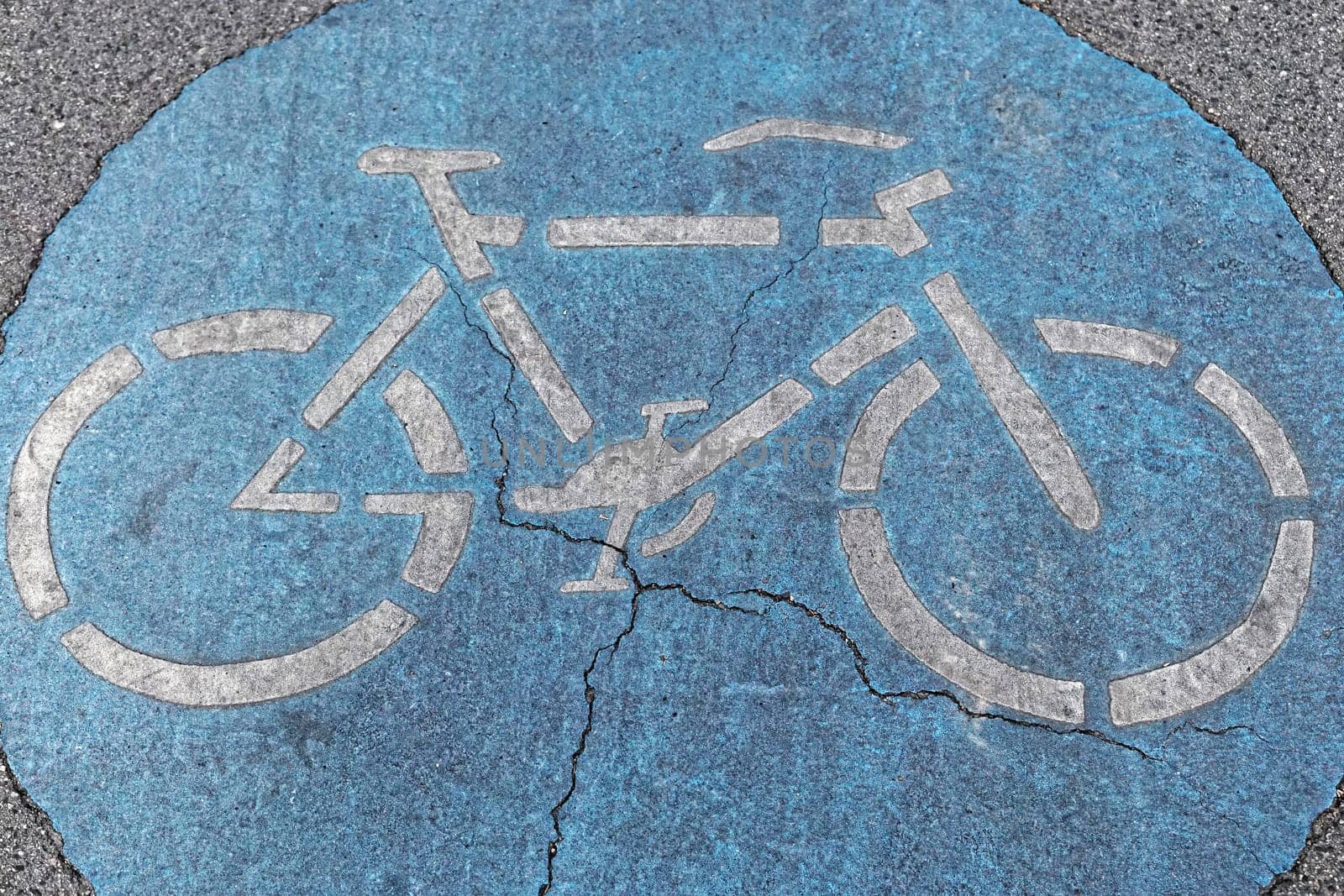 Bike path sign at street pavement