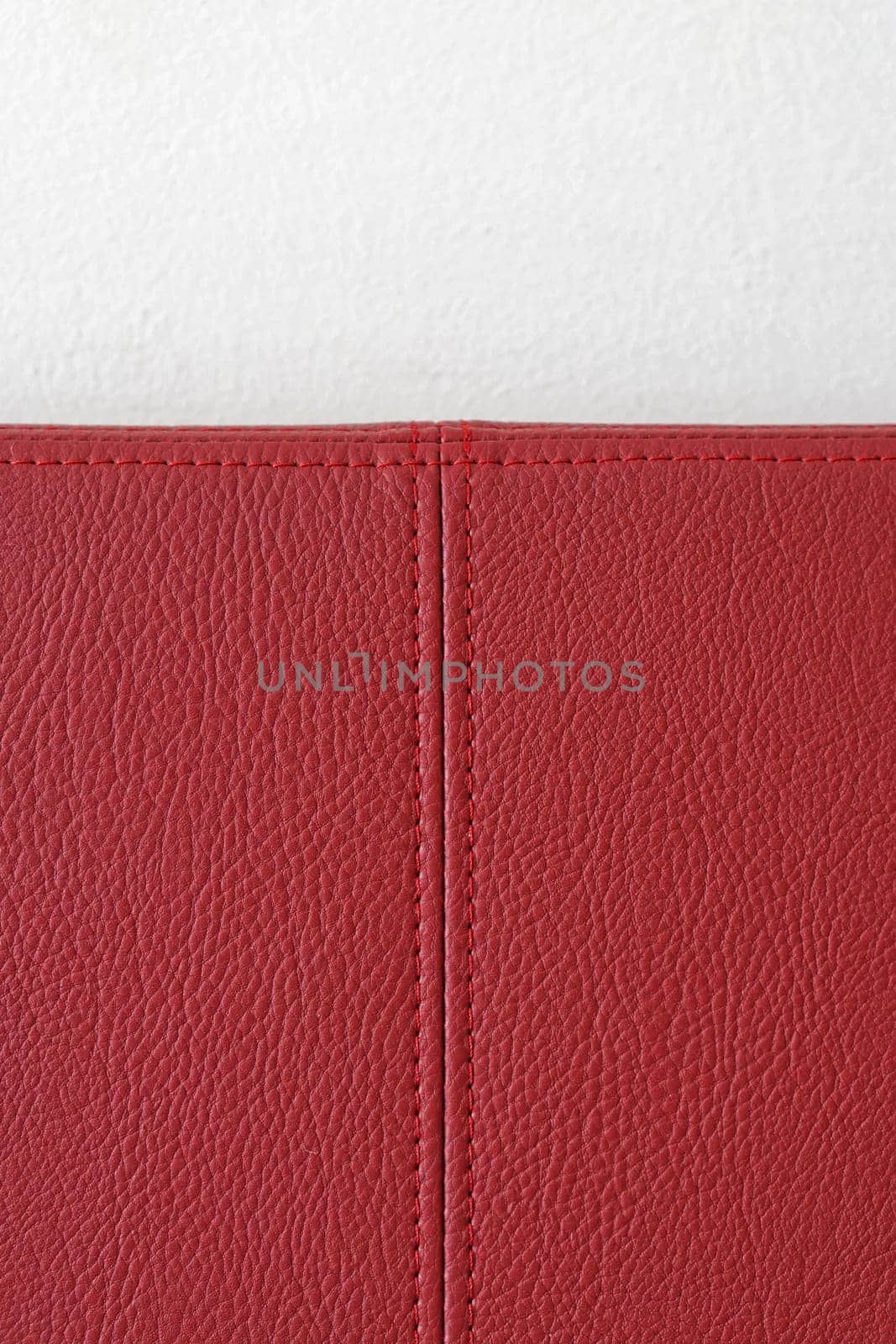 Red leather material with stitching