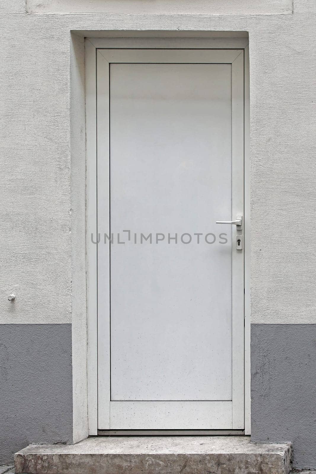 Closed white door at house exterior