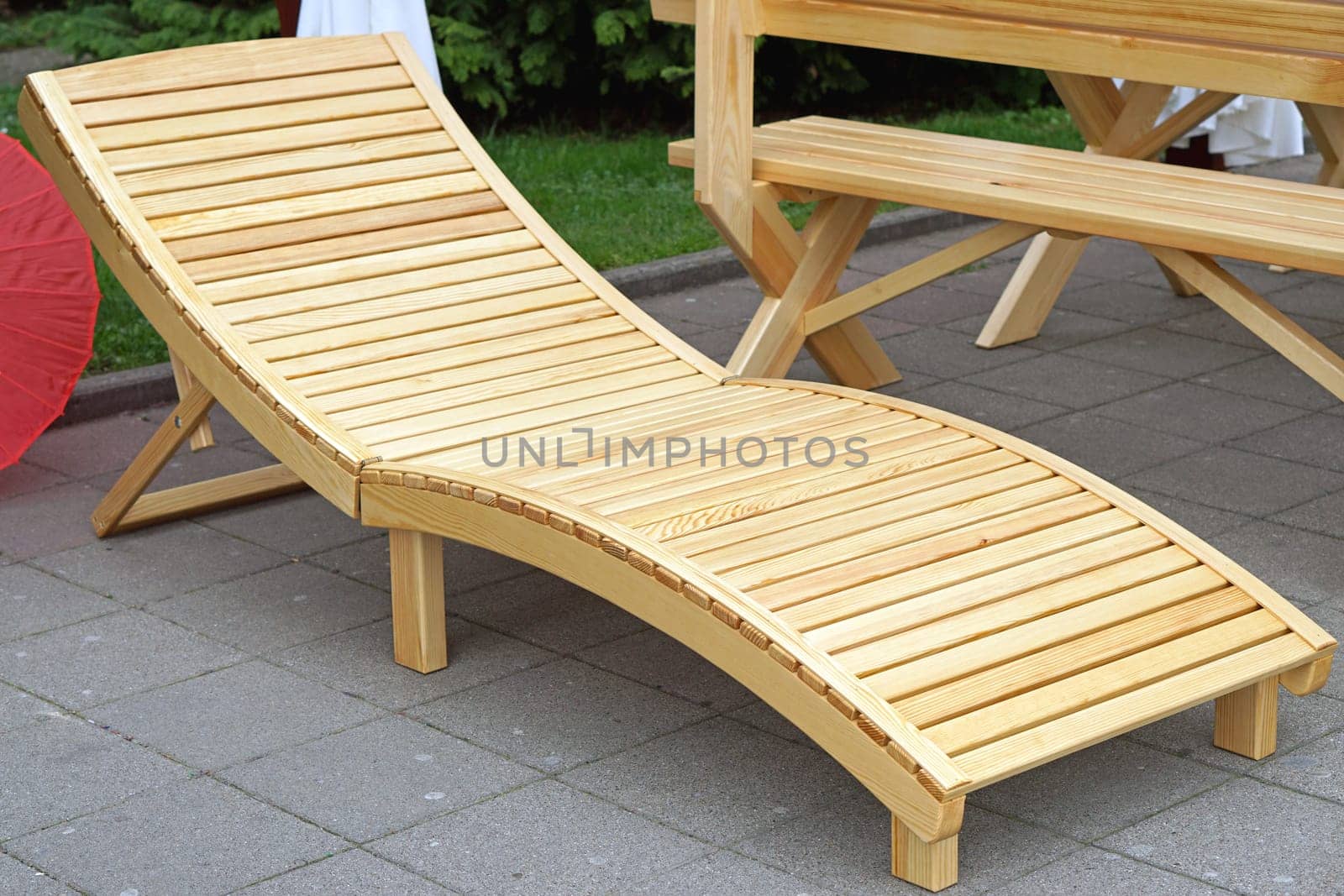 Wooden lounge chair at outdoor patio