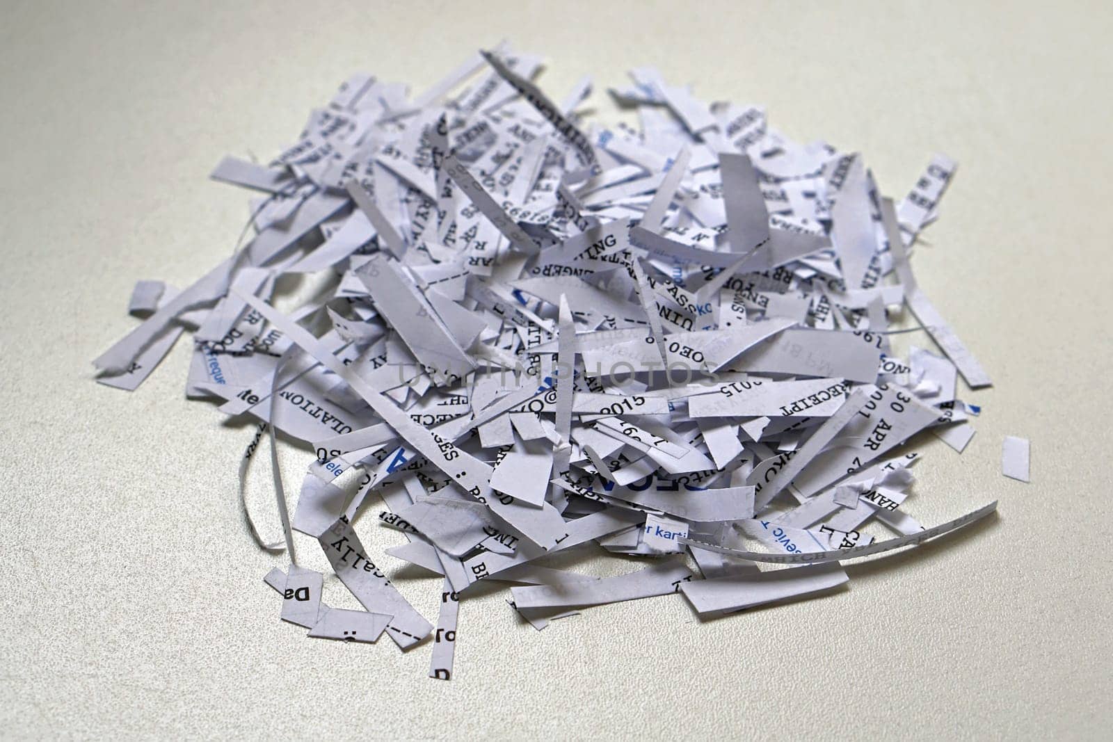Shredding paper with confidential and senzitive private documents