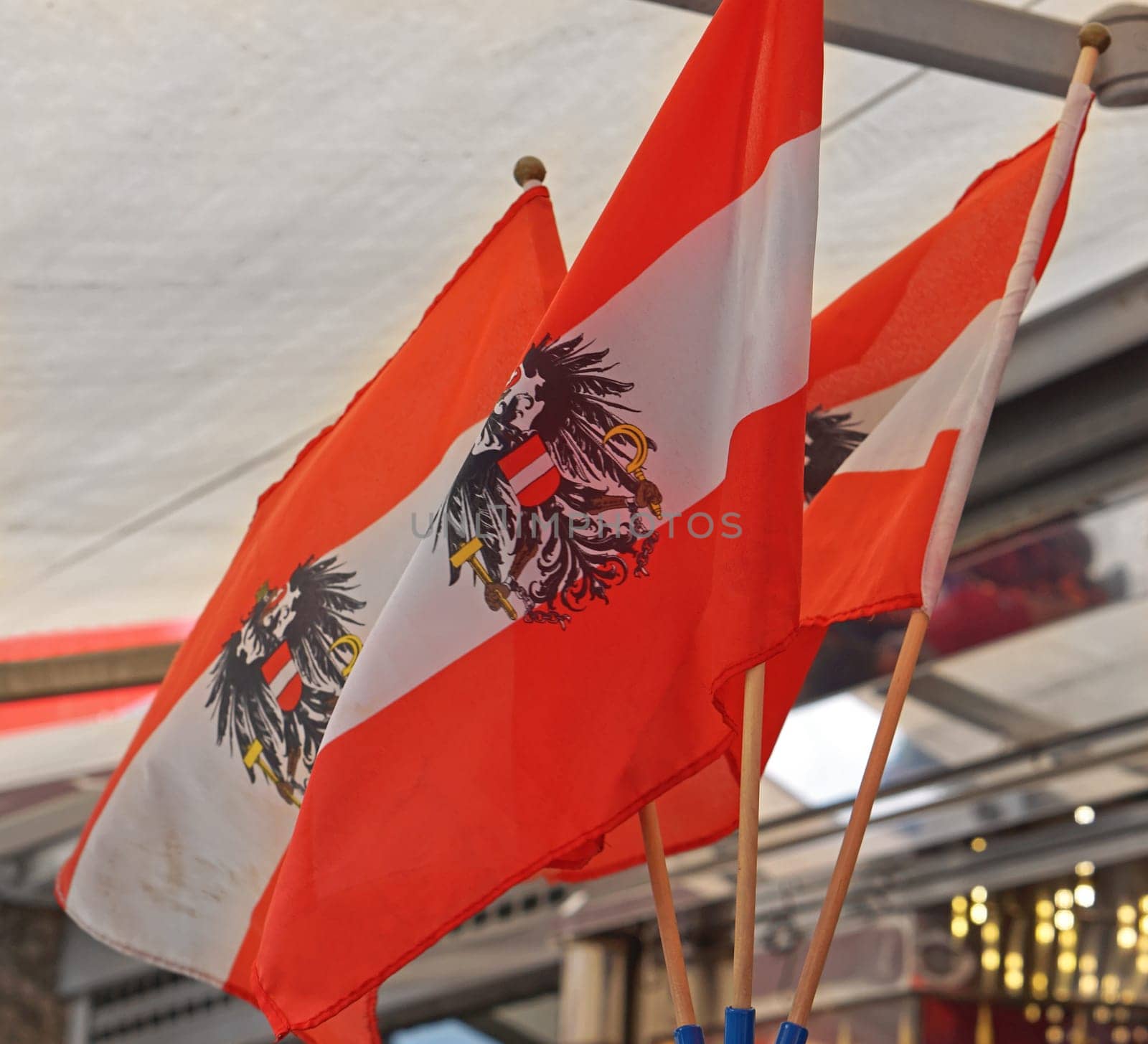 Three Austrian flags with eagles
