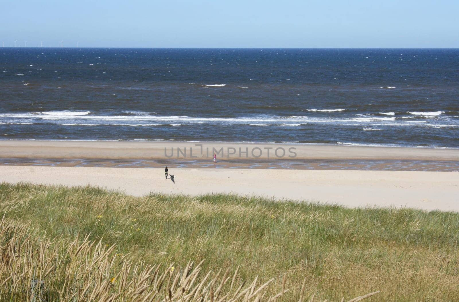 a long lonely sand beach, on the North Sea