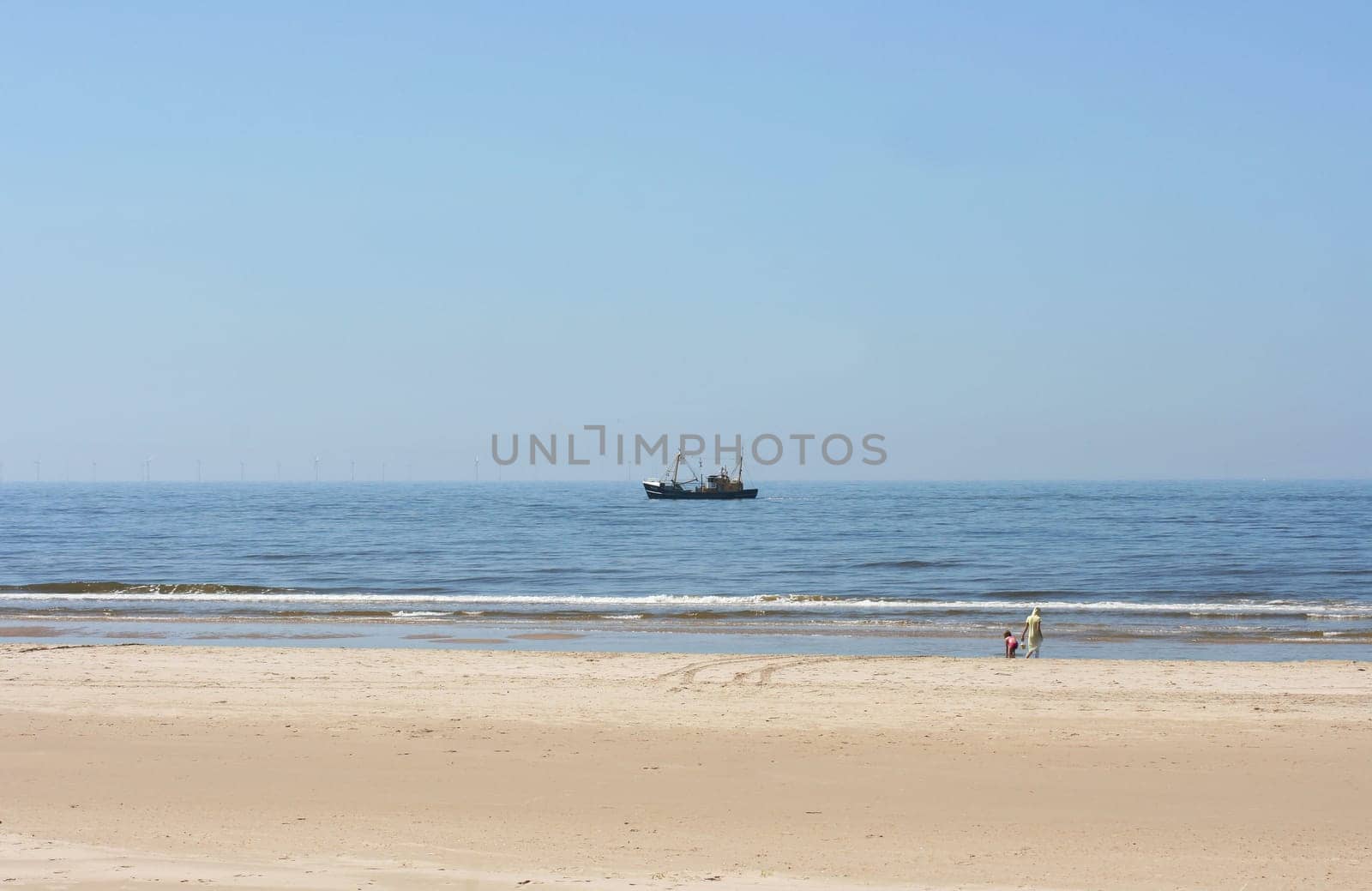 a long lonely sand beach, on the North Sea