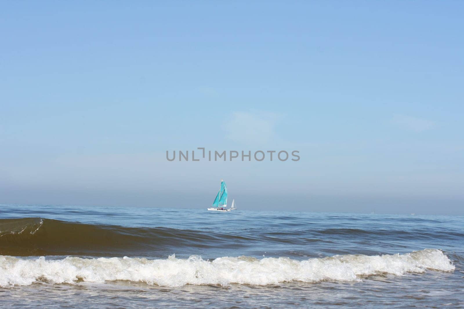 Waves of white foam Crown roll over the sea surface