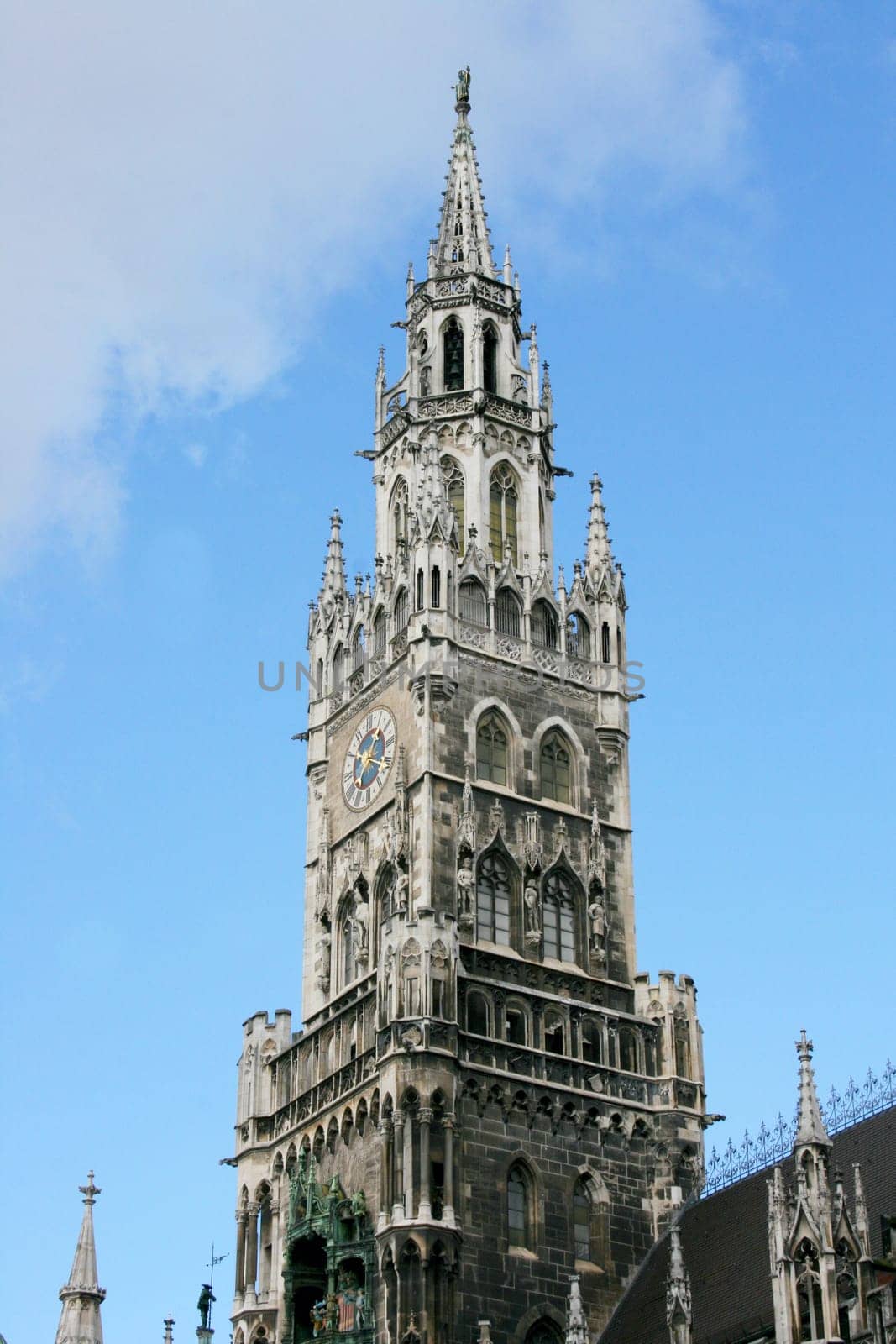 Church with  cross and clock, in the Bavarian State capital of Munich.