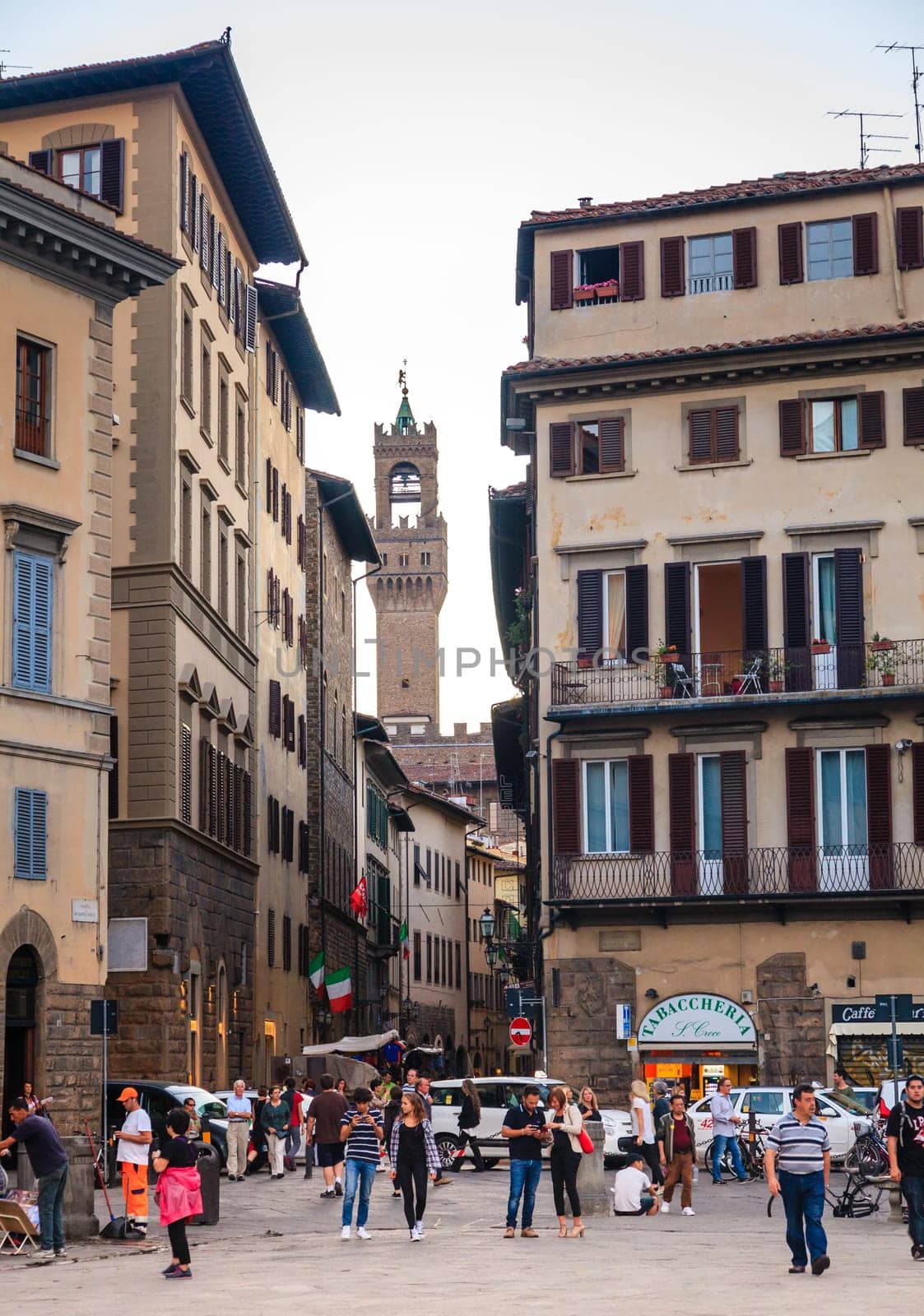 Florence, Italy, September 20, 2015: View of the Arnolfo’s tower of Palazzo Vecchio from Piazza di Santa Croce in Florence, Italy