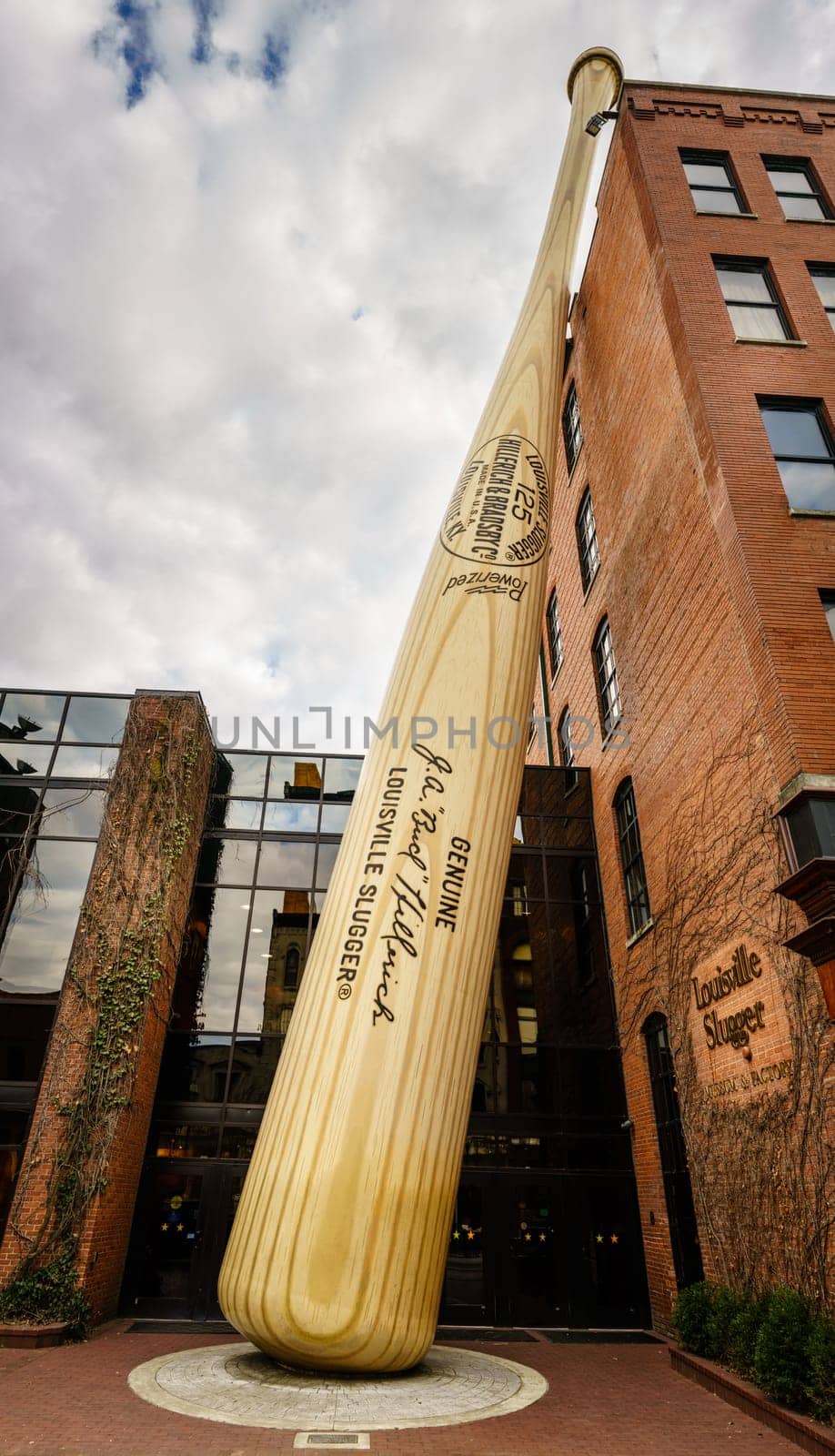 Louisville, KY, February 23, 2020: Oversized baseball bat sculpture in front of Louisville Slugger museum and factory in downtown Louisville, Kentucky