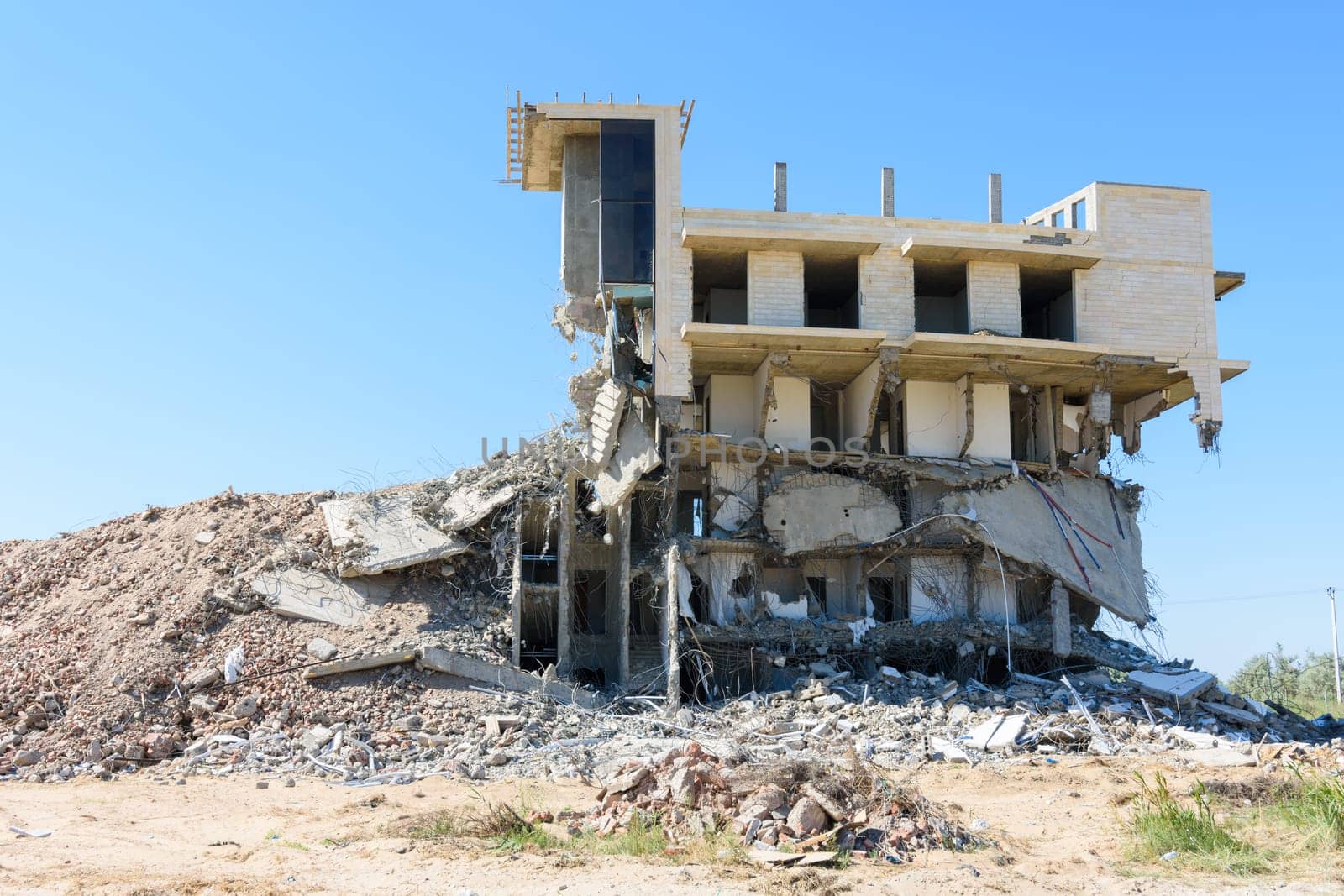 Half-destroyed building due to illegal development of the coastal strip