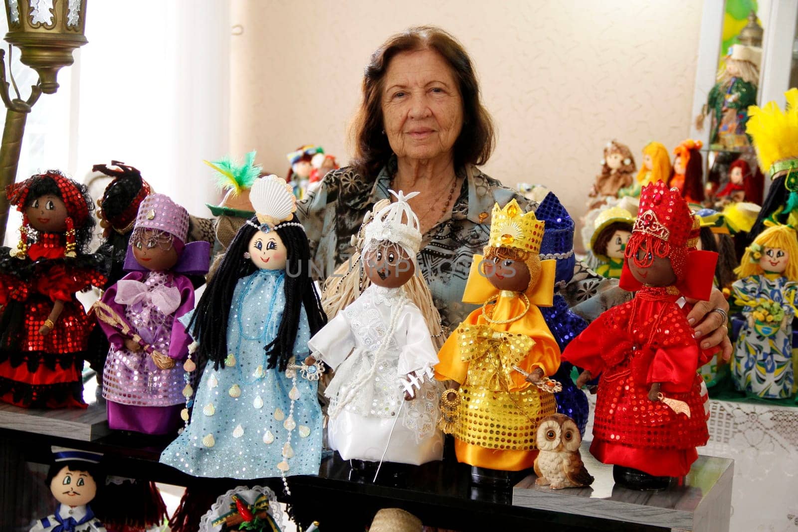 salvador, bahia / brazil - june 9, 2014: Alzerinda Azevedo, decorates liquor bottles with handcrafted tecnca.