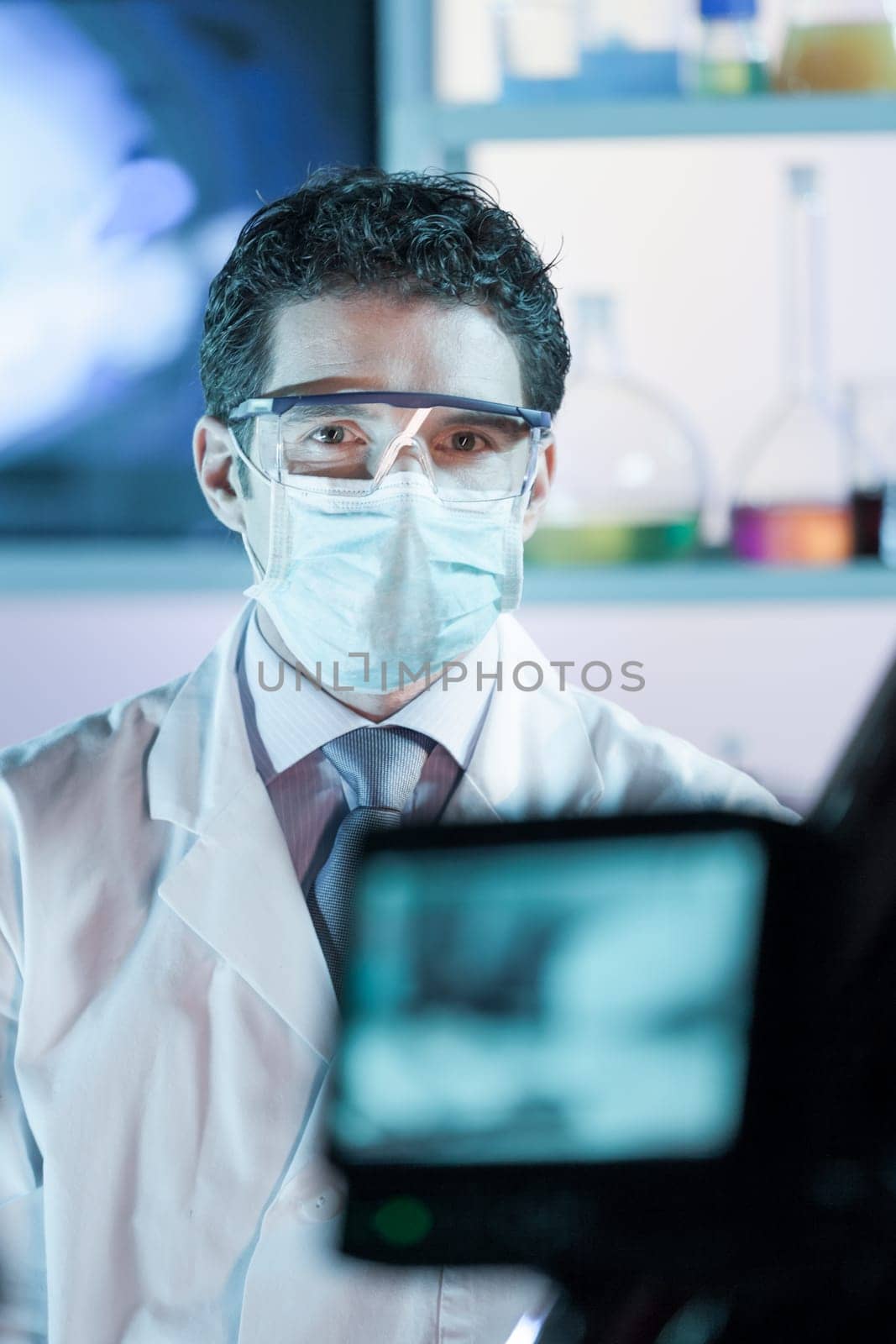 Laboratory hospital clinic doctor, scientist or exper, wearing protacive mask while addressing public in media interview explaining preventive measures against corona virus pandemic outbreak.
