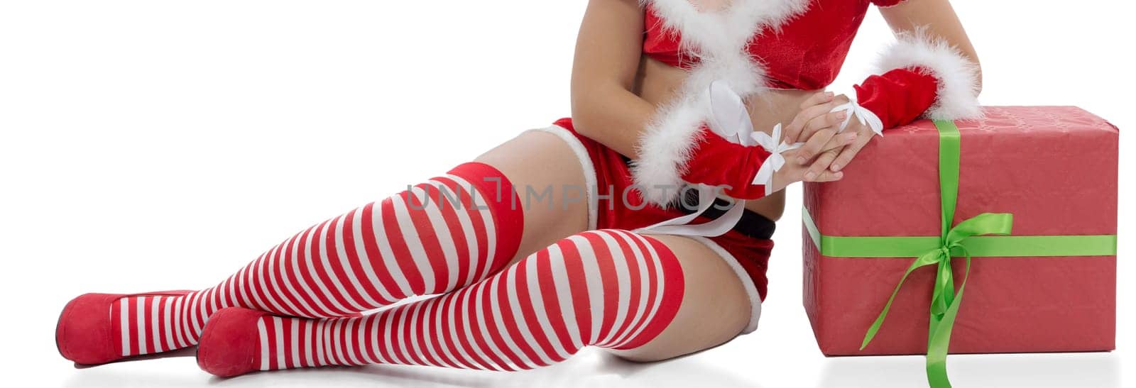 Sexy Santa woman legs isolated on the white background