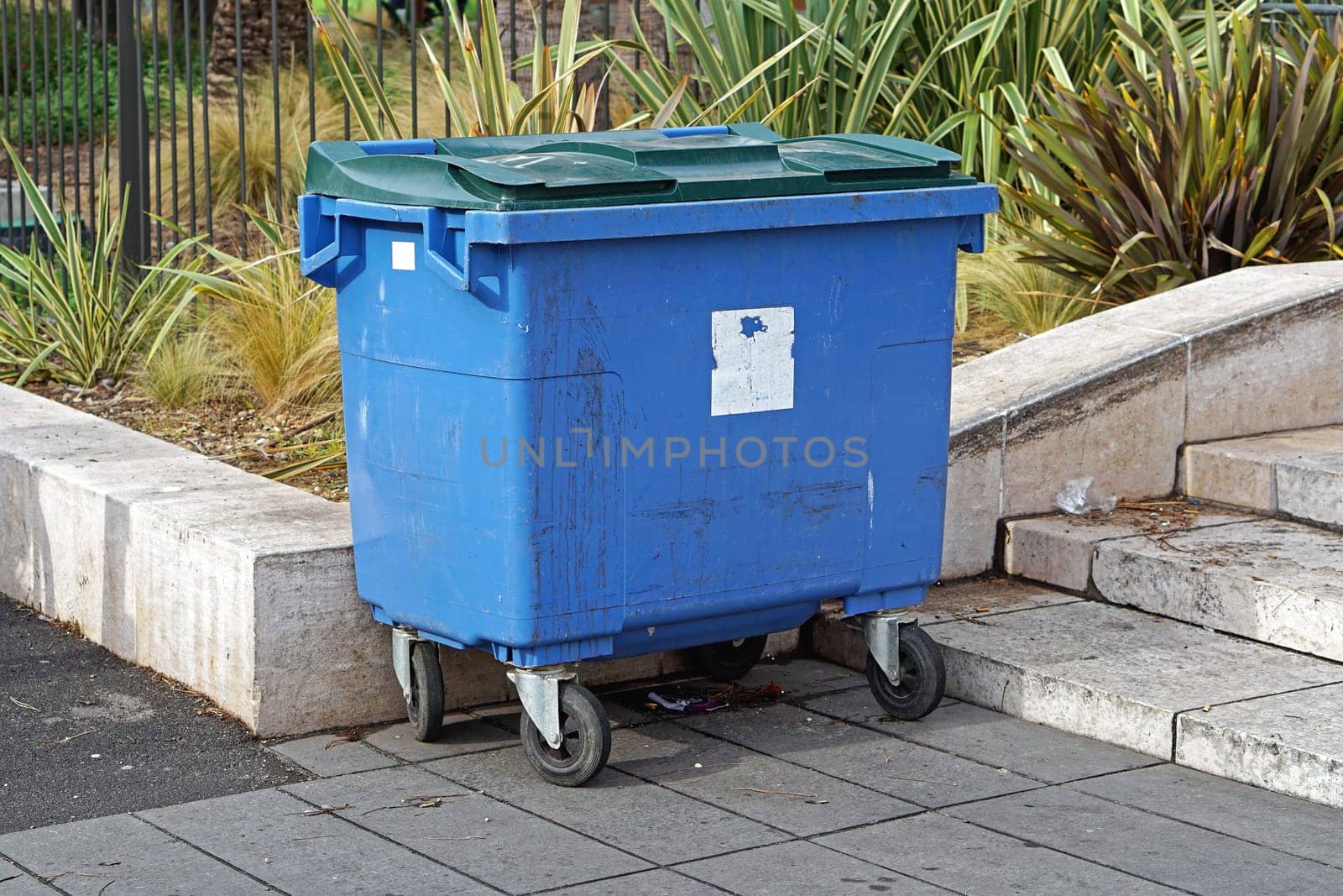 Blue plastic container for garbage and trash