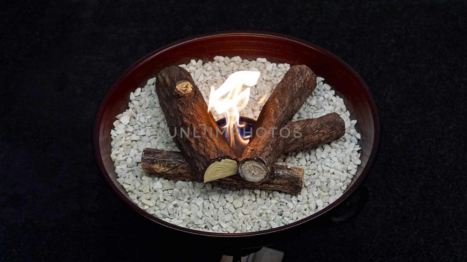 Artificial fire in decorative tray at home