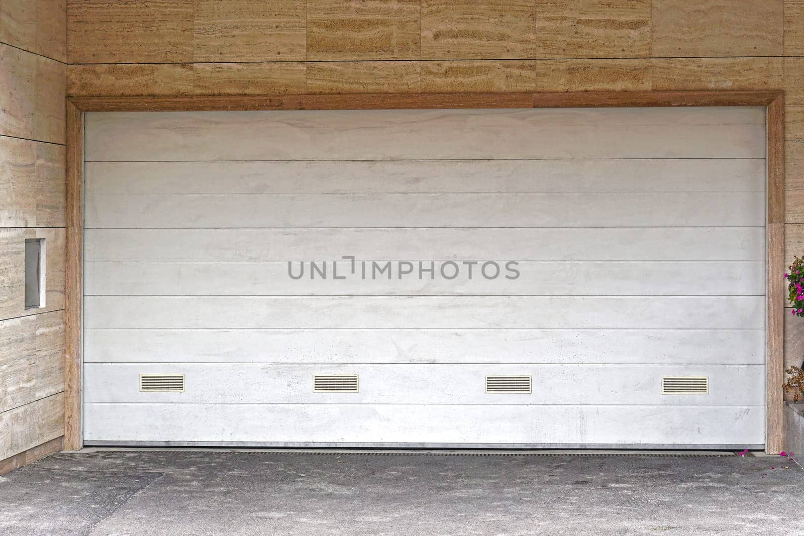 Wide white garage door closed