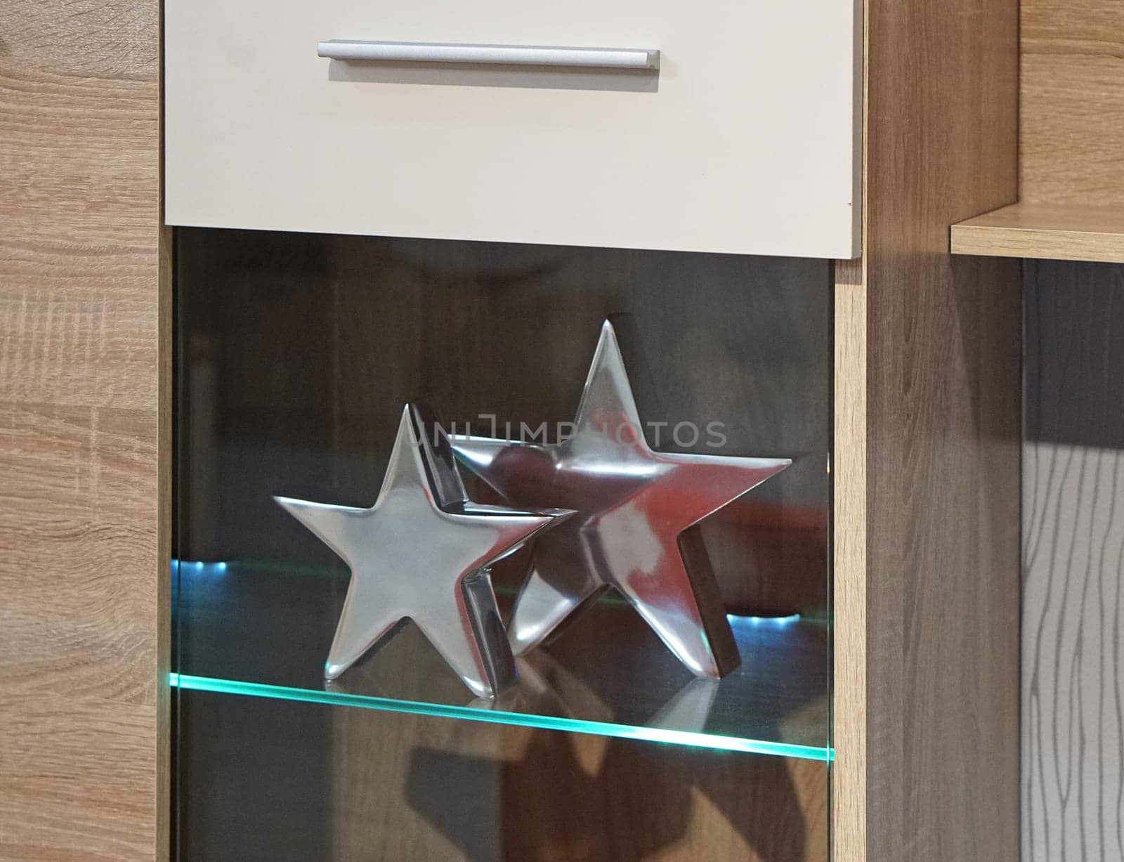 Two silver stars decoration in cabinet