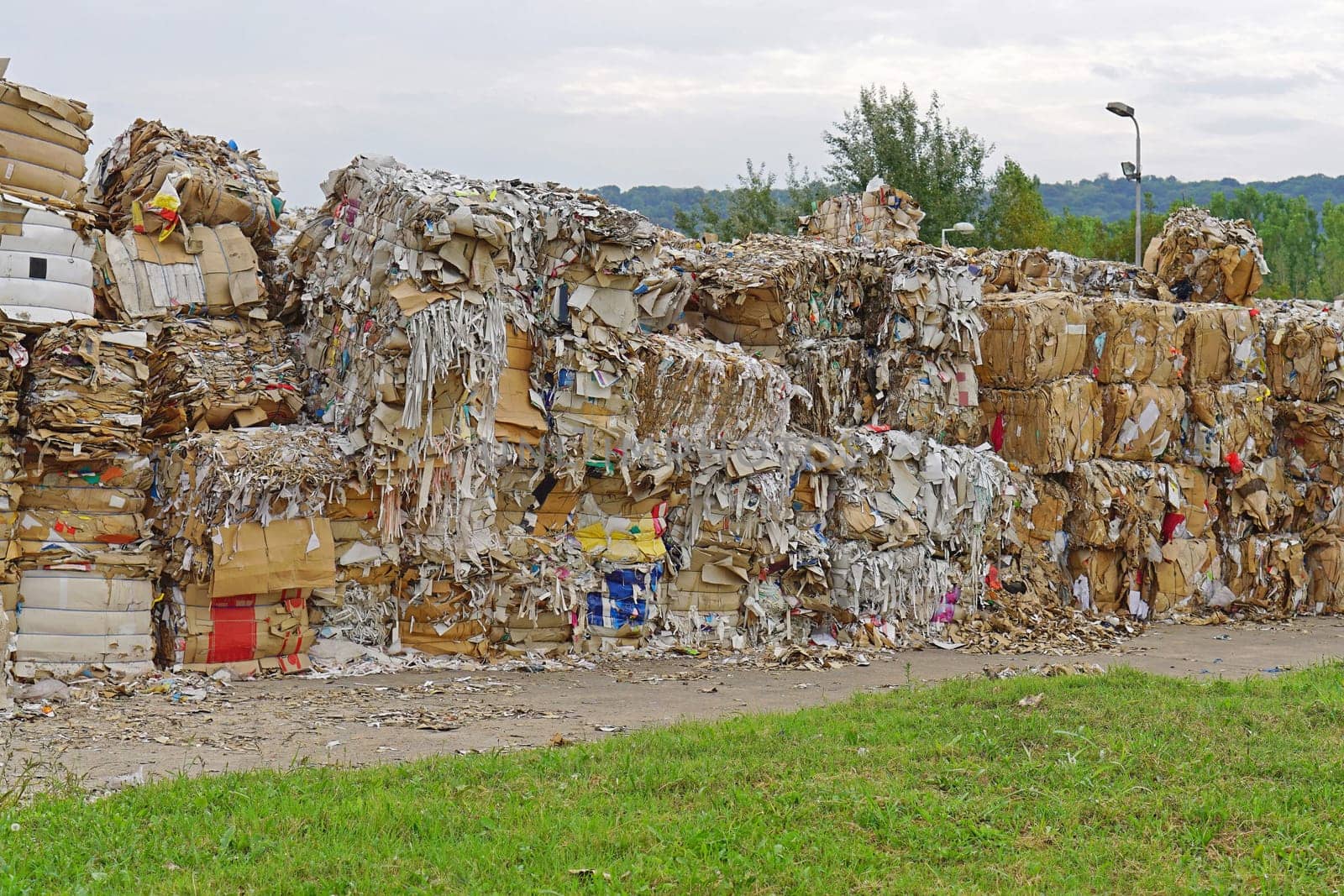Paper and carboard carton material stacked for recycling
