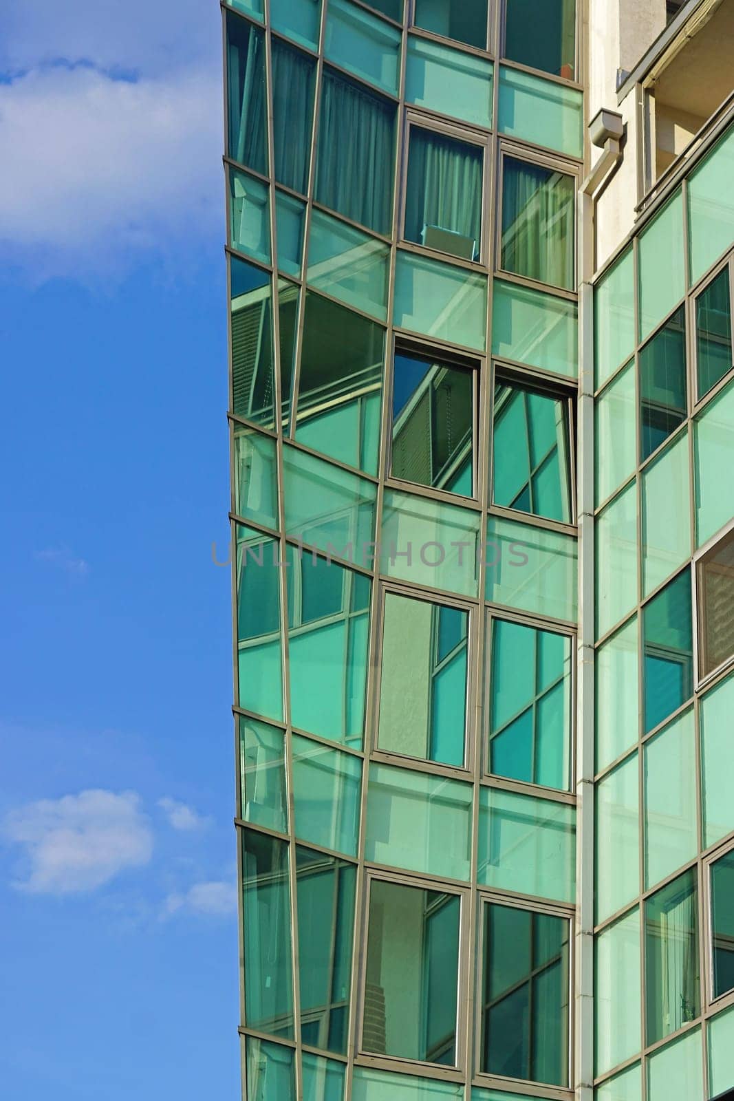 Modern skyscraper with green glass windows