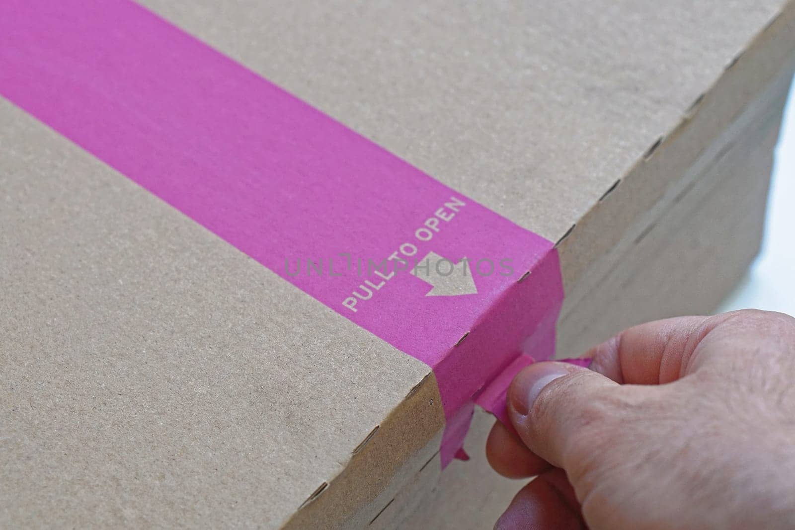 Pull to open strip at box