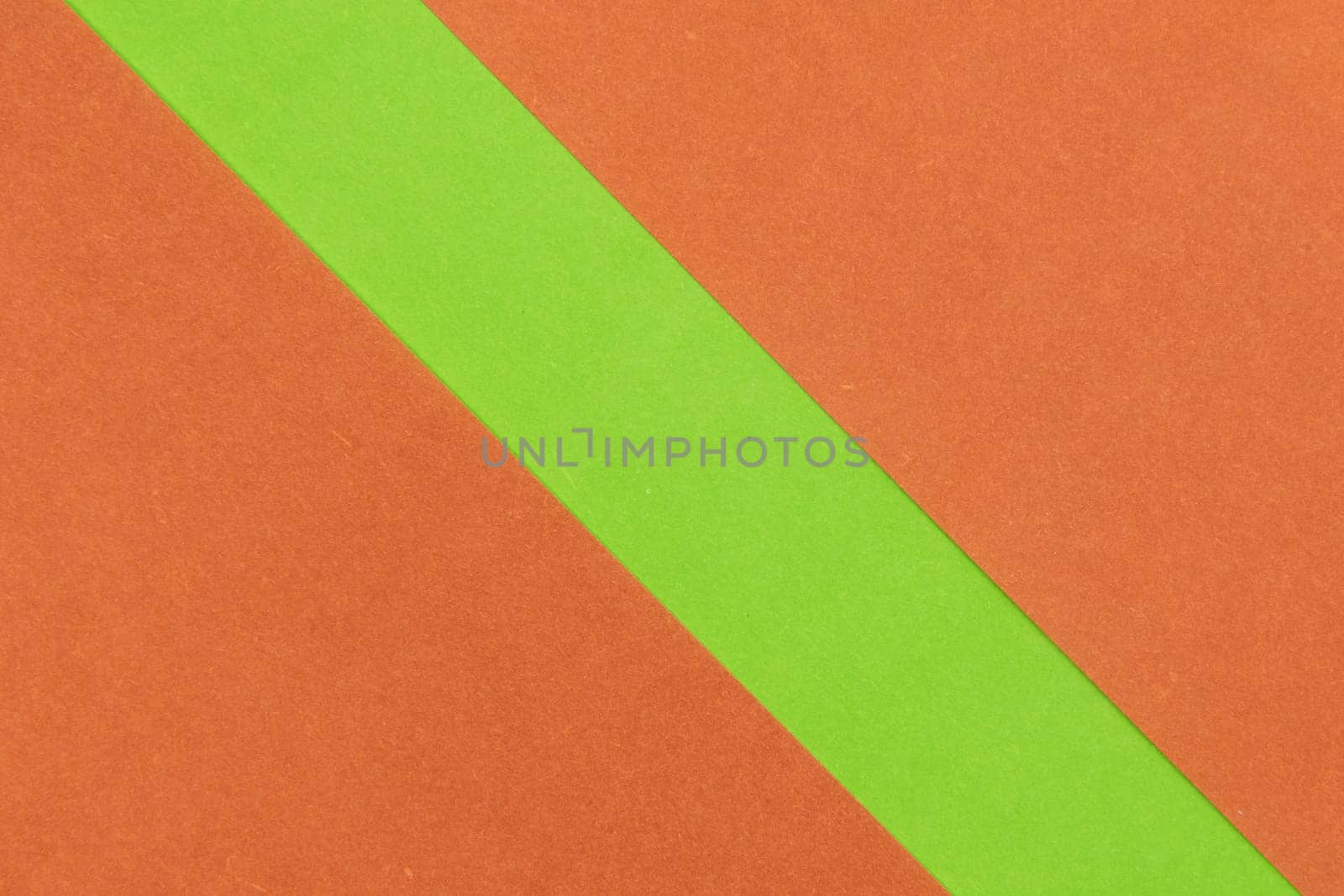 Green and Orange coloured paper background, abstract contrast conceptual image