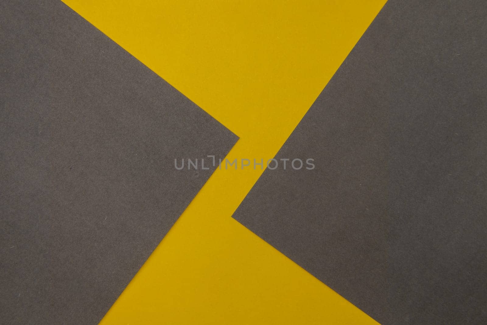 Grey and Yellow coloured paper background, abstract contrast conceptual image