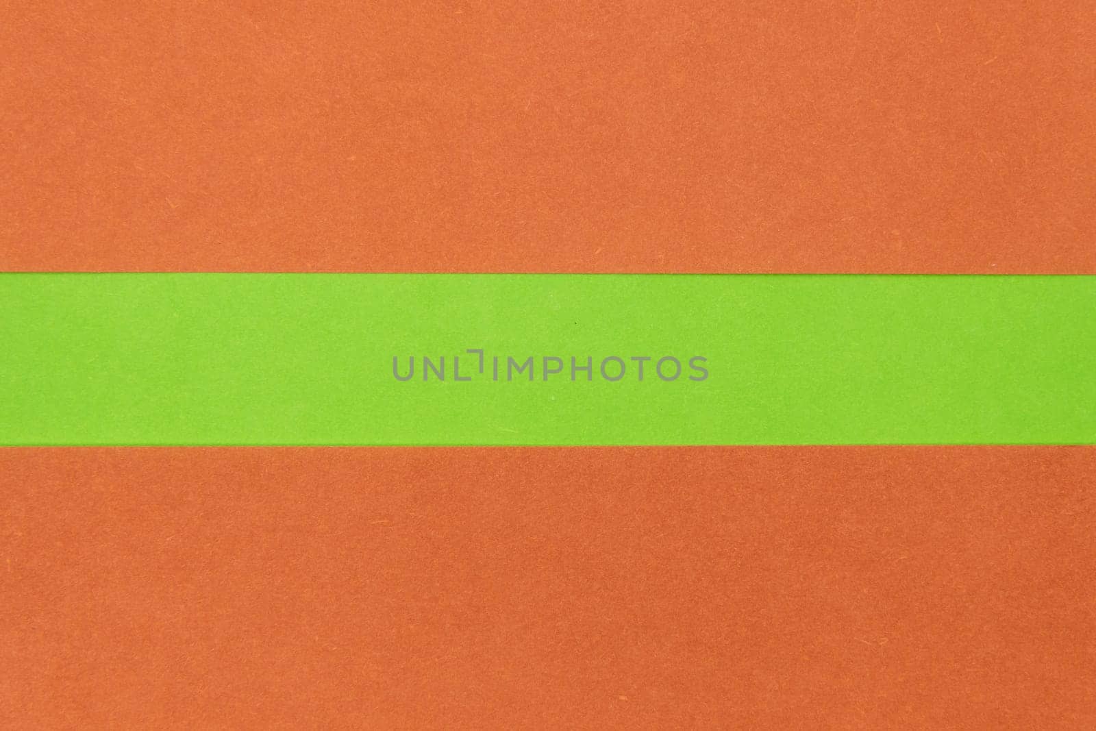 Green and Orange coloured paper background, abstract contrast conceptual image