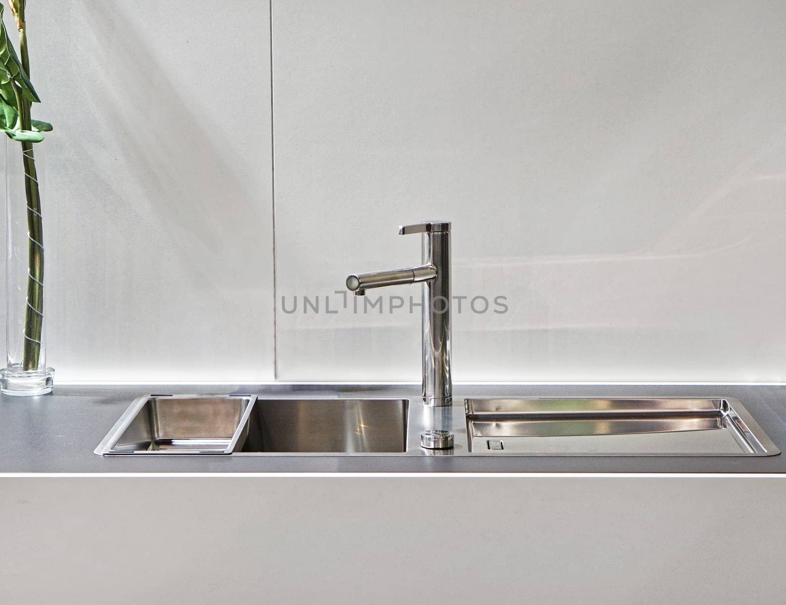 Modern sink with faucet in white kitchen
