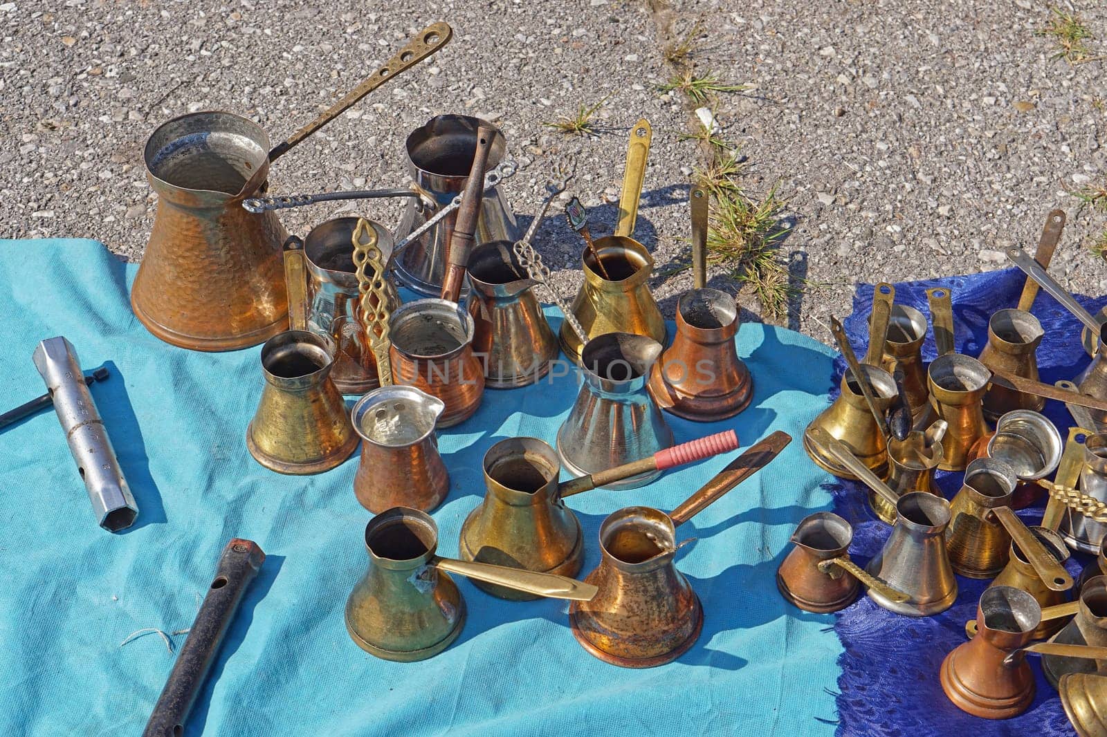Many old brass and copper coffee pots