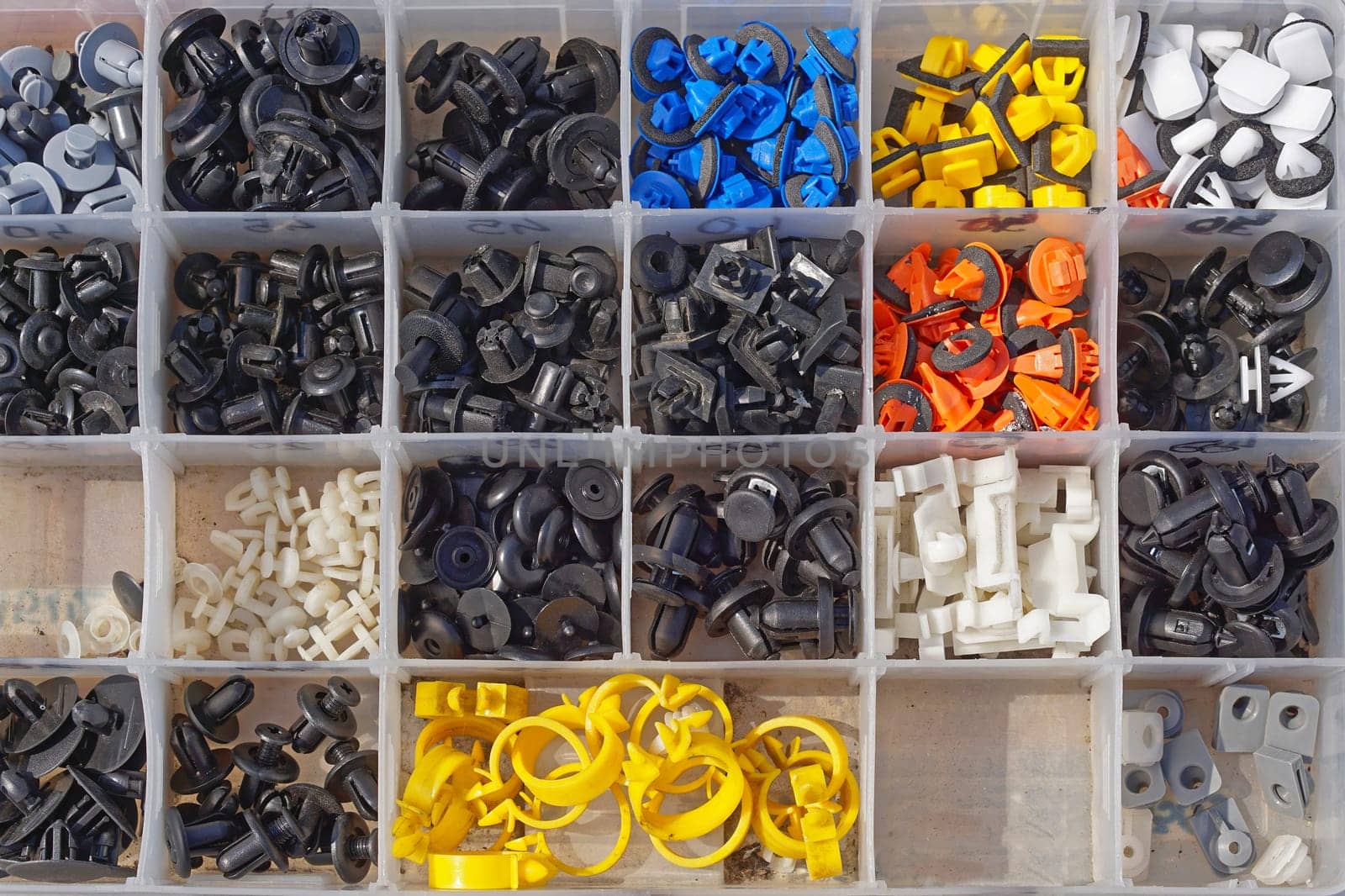 Various small plastic car parts for interior in box