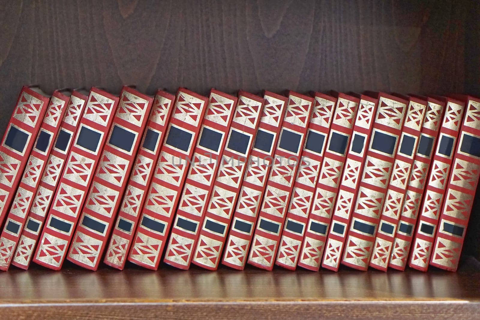 Books collection at wooden book shelf