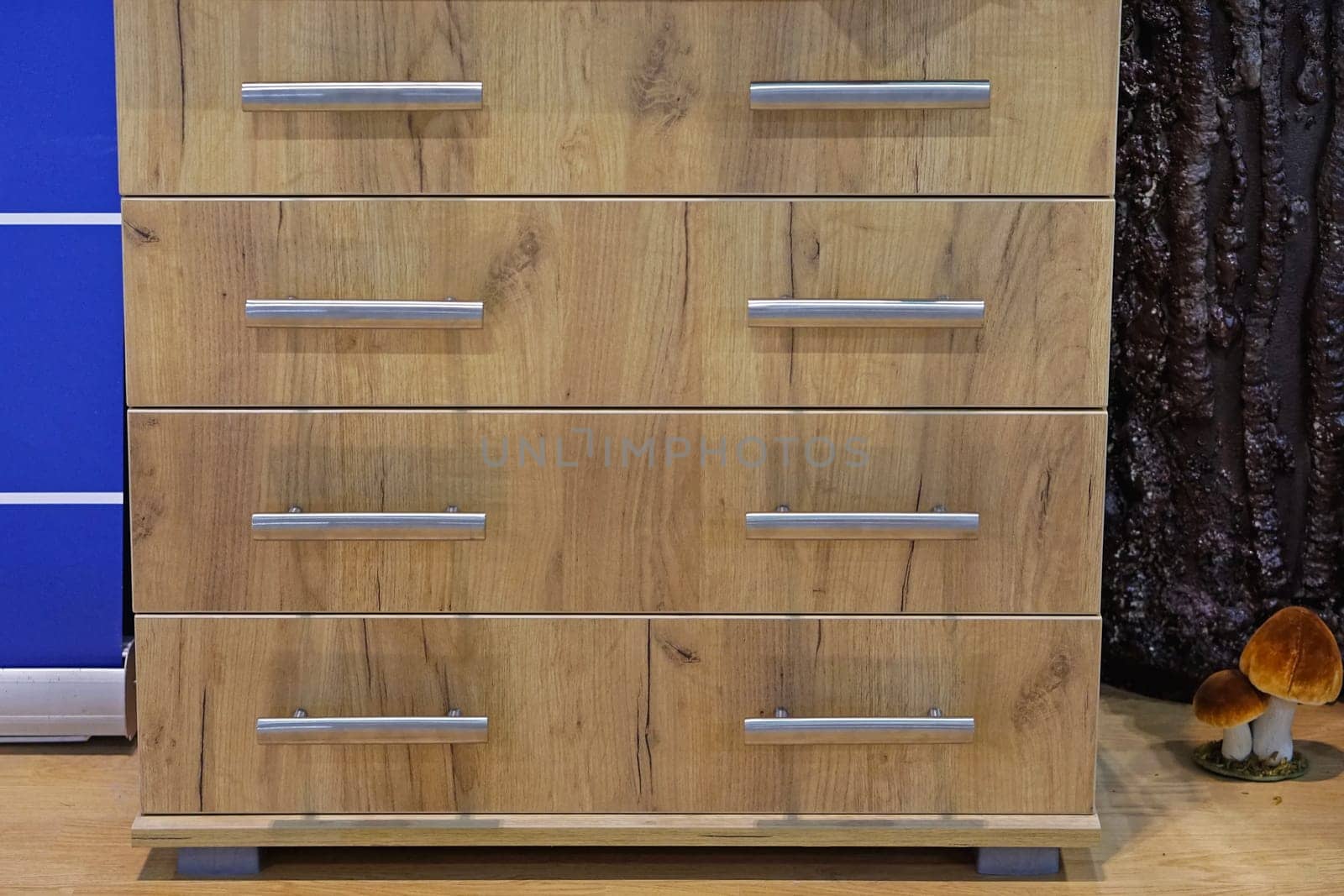 Modern wooden cabinet with drawers in home