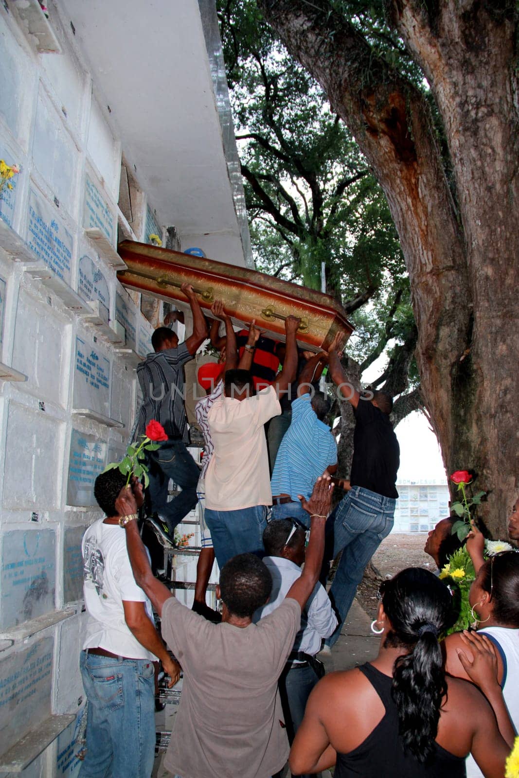 salvador, bahia / brazil - november 7, 2012: people are seen during seputation of a person in the Quinta dos Lazaros cemetery in the city of Salvador.
