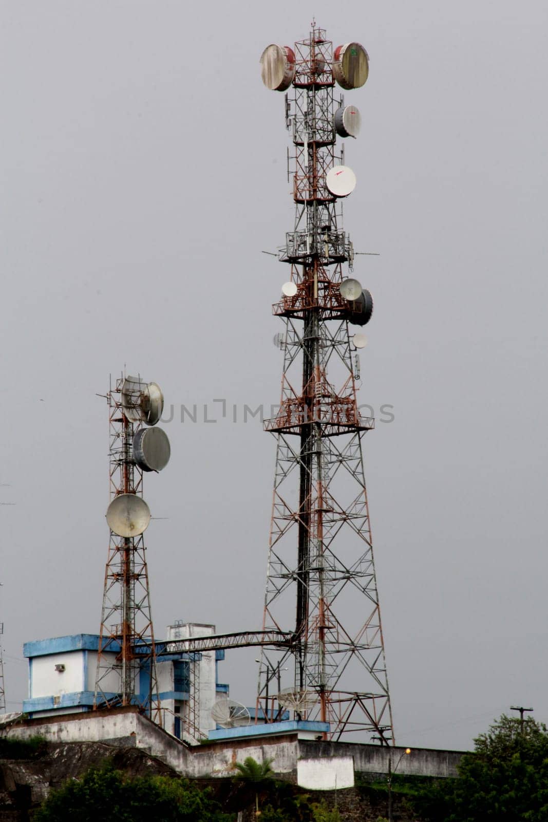 itabuna, bahia / brazil - july 15, 2012: tower with cell antennas is seen in the city of Itabuna, southern Bahia.