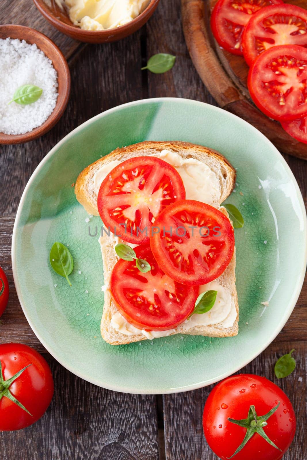 Open sandwich with fresh vine tomatoes and basil