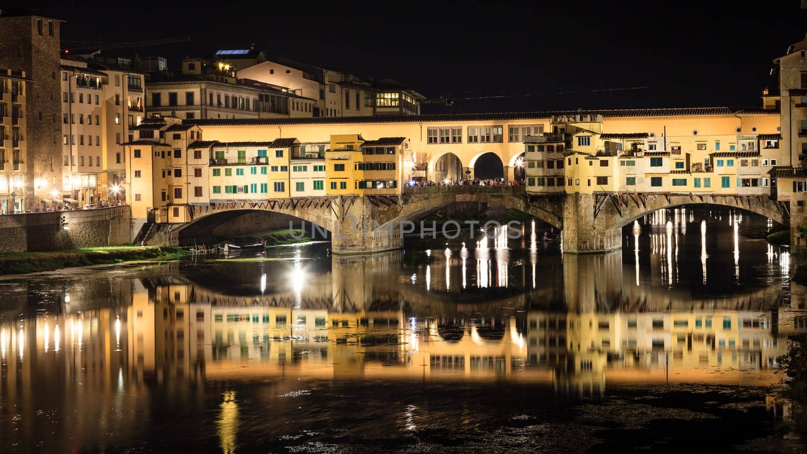 View of the Ponte Vecchio or Old Bridge across the Arno River in Florence, Italy at night